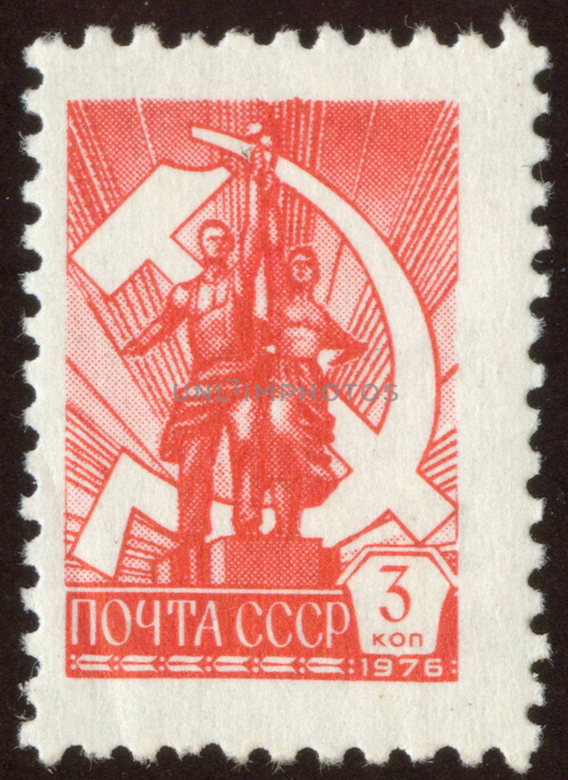 The scanned stamp. The Soviet stamp. Monument to the worker and the collective farmer.