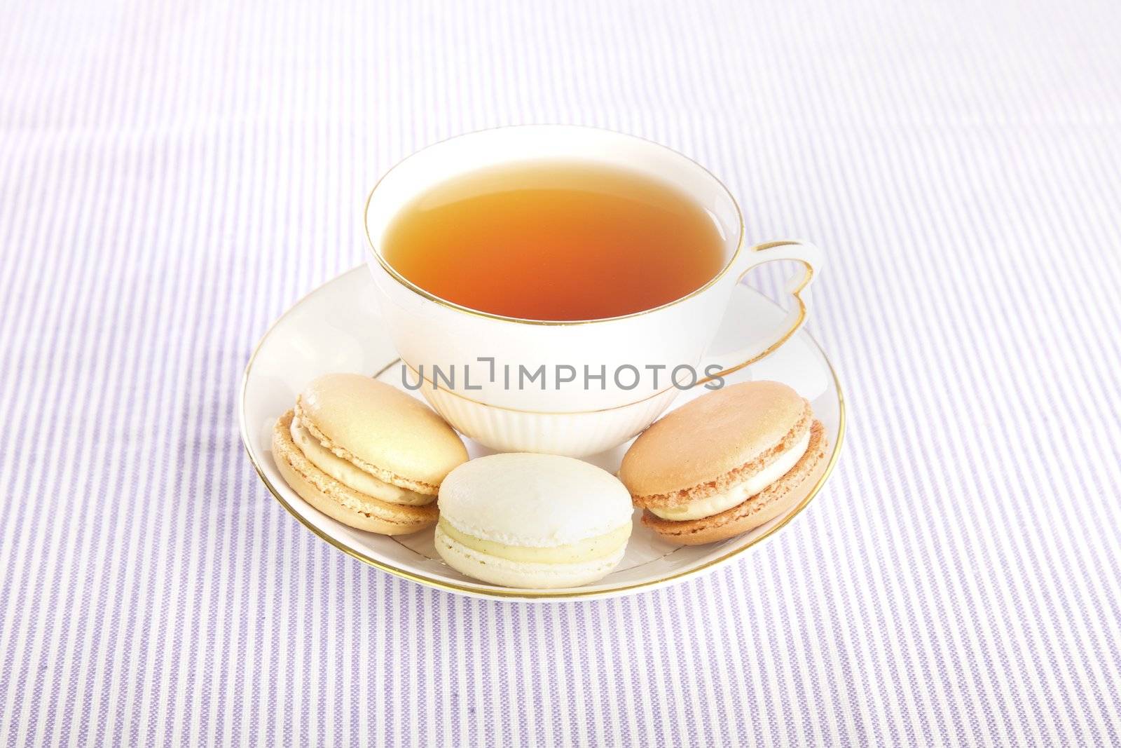 Delicate porcelian cup of tea and macaroons, Bed and Breakfast display
