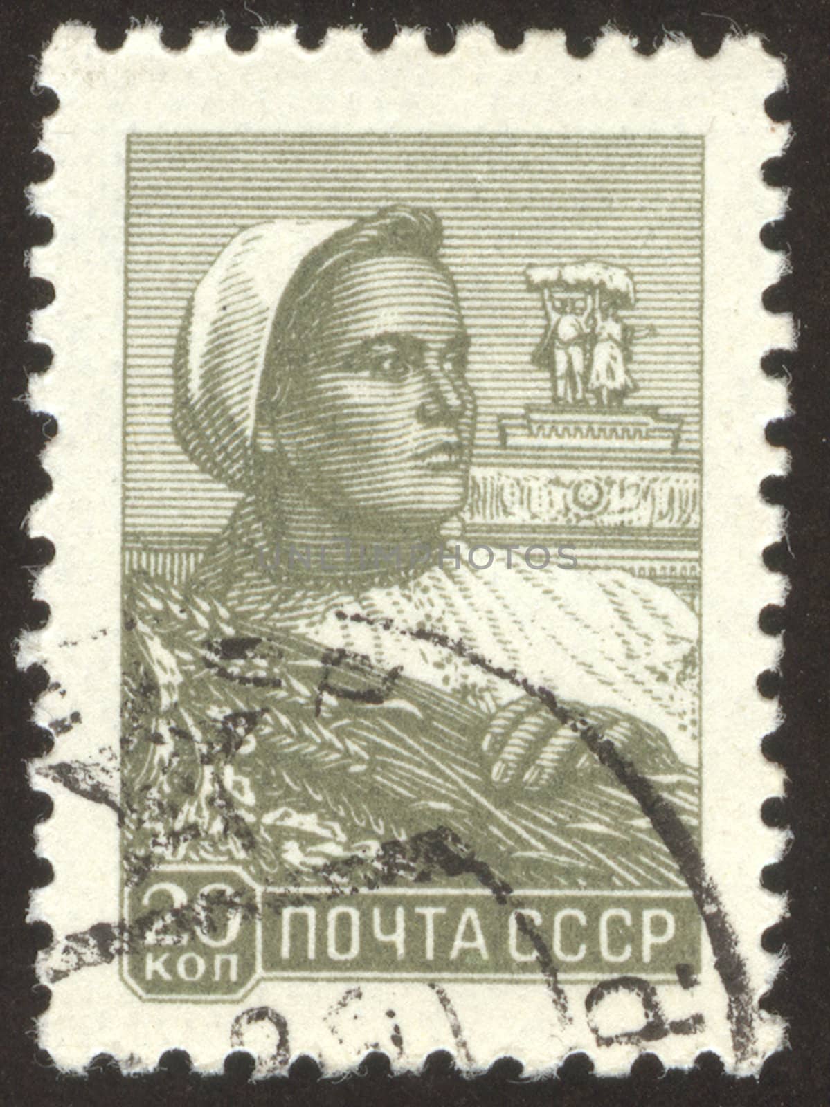The scanned stamp. The Soviet stamp. The woman reaps wheat crop.