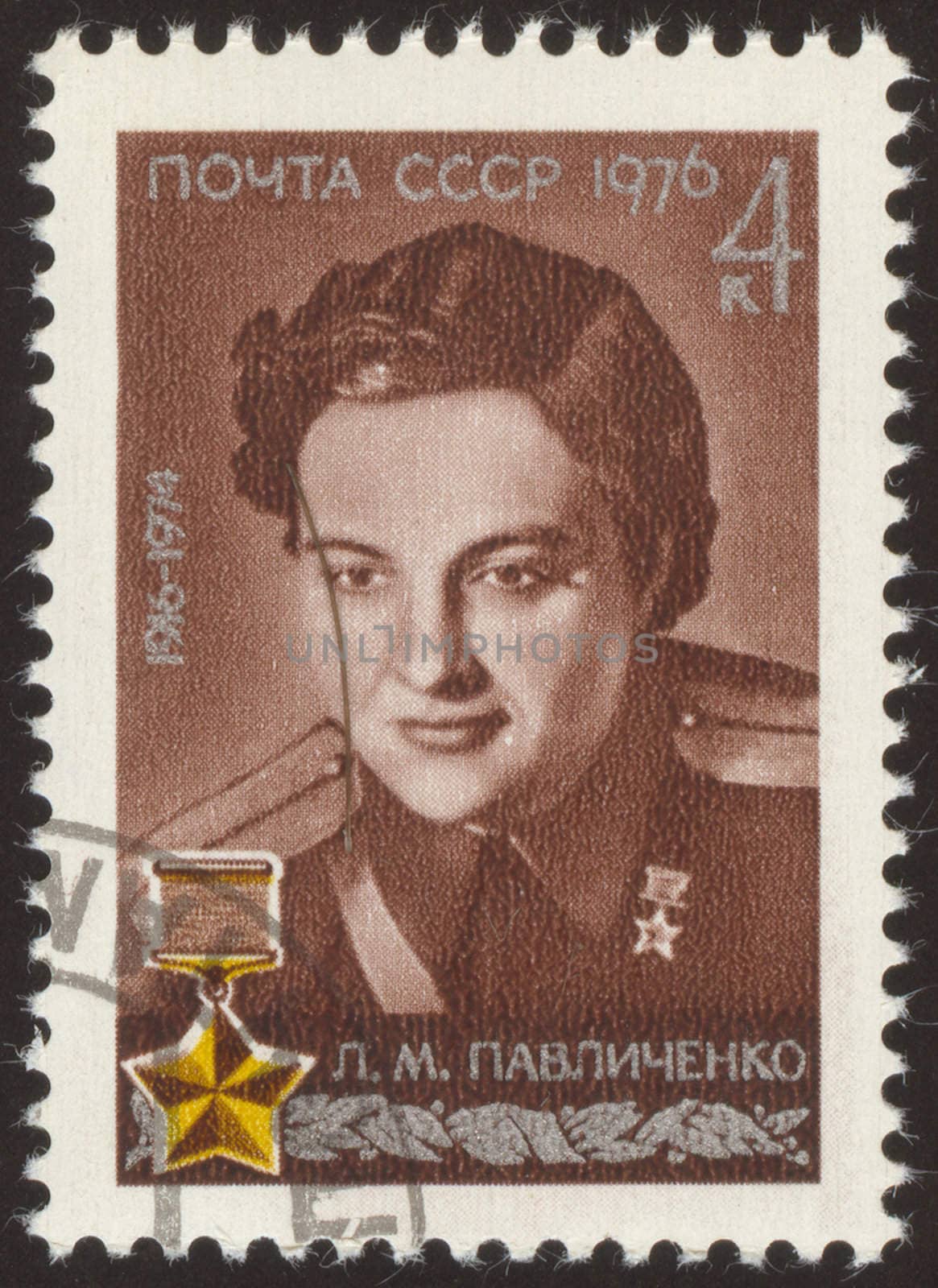 The scanned stamp. The Soviet stamp. The woman the officer, the military pilot.