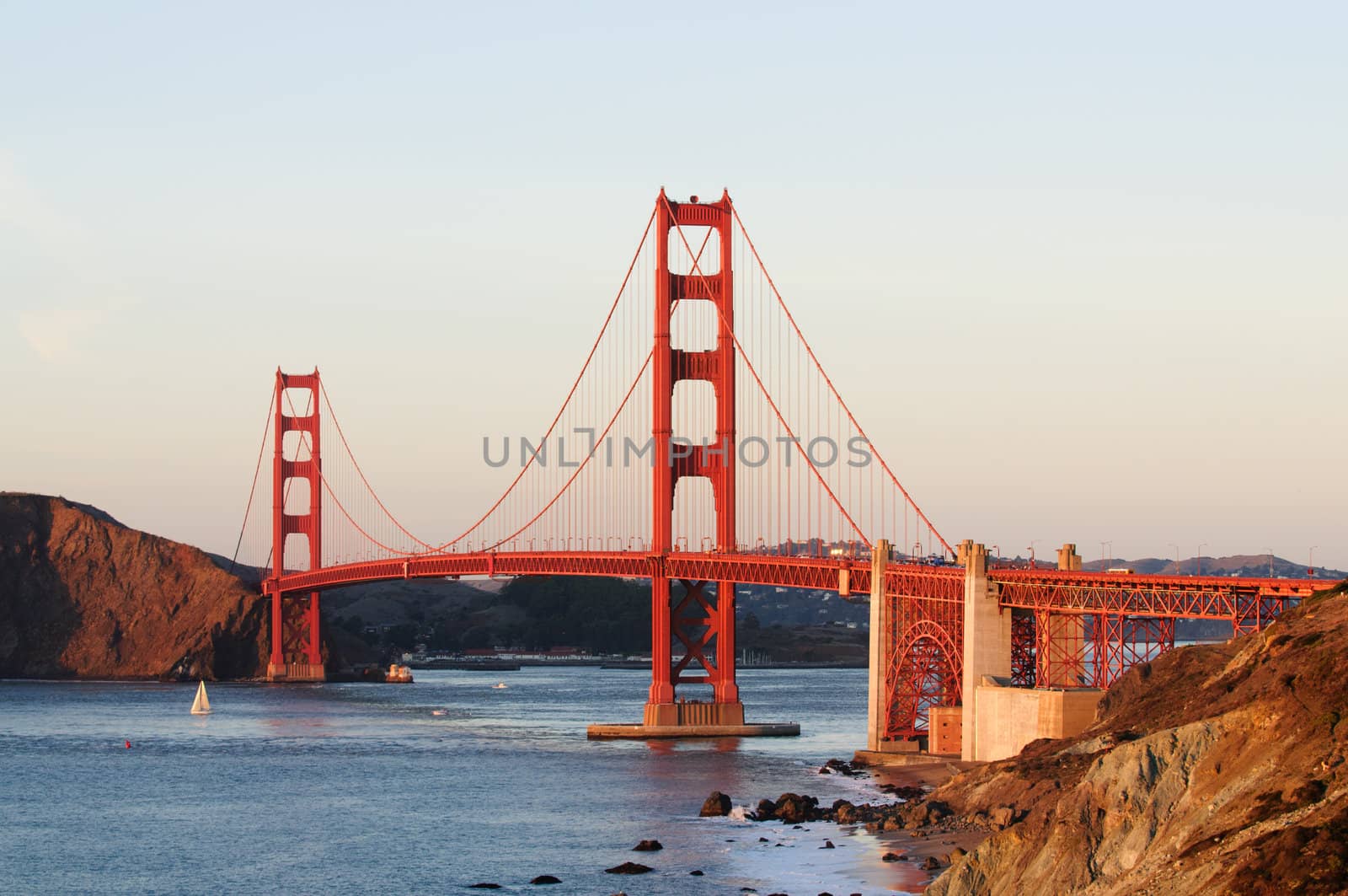 Golden Gate Bridge from Bakers Beach area in San Francisco at sunset