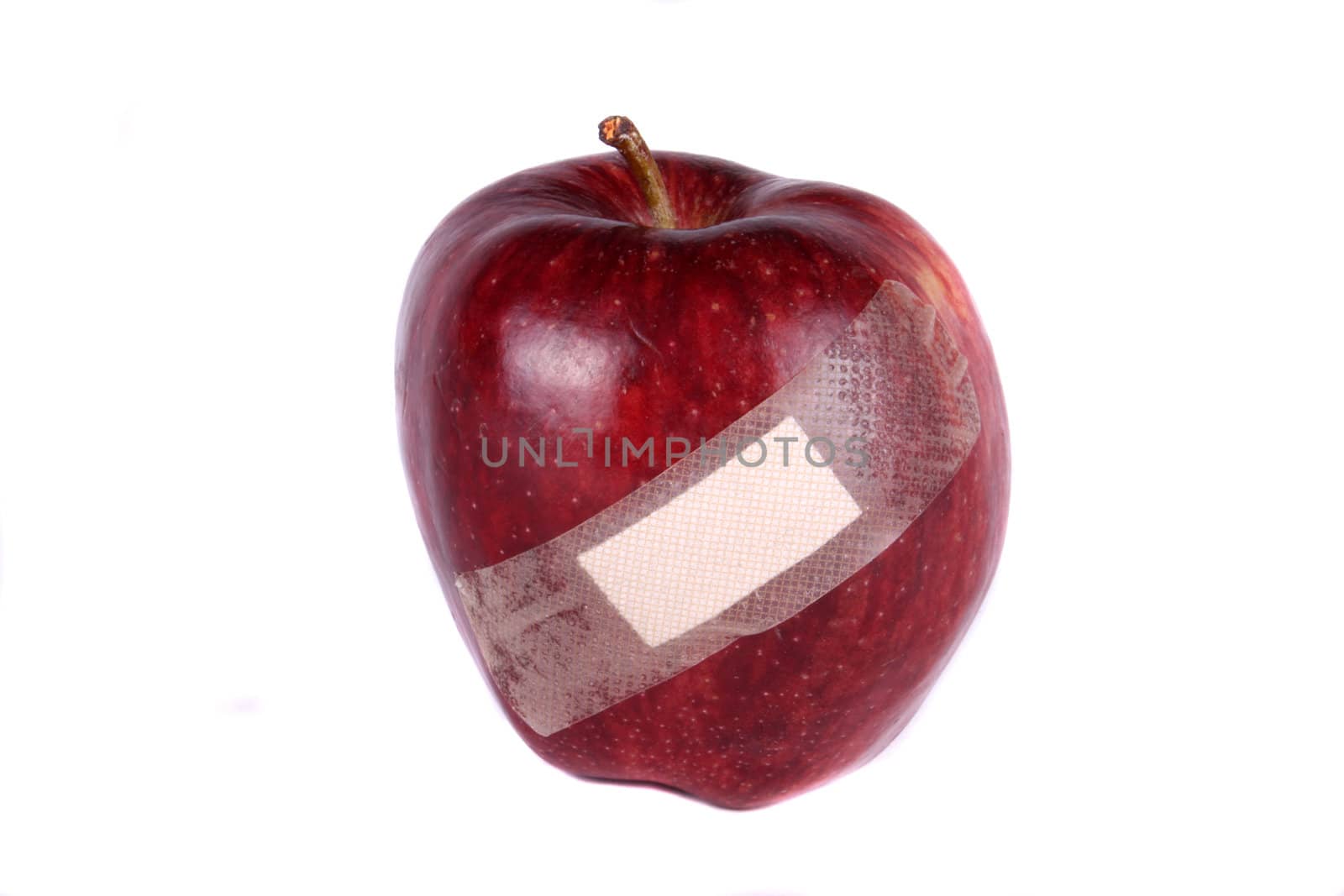 A metaphorical image of an apple wounded due to genetical modification.