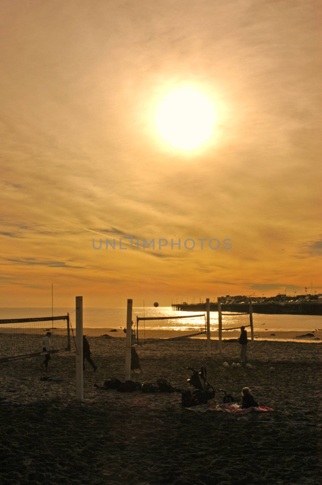 People playing volley ball early ione winter morning on the beach at Santa Cruz, California     