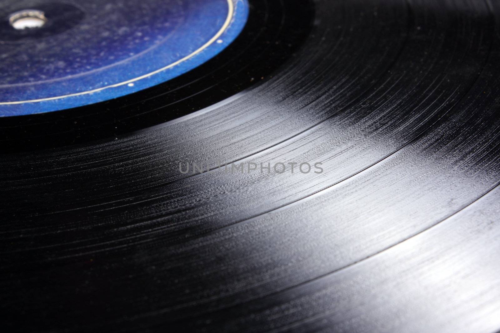 A background with a closeup view of an old LP-Longplay / Gramophone record.