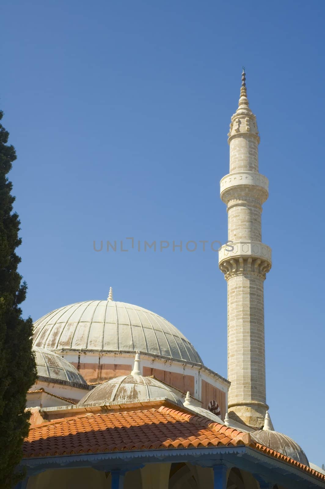 the tower and dome of a Islamic mosque in Rhodes Greece