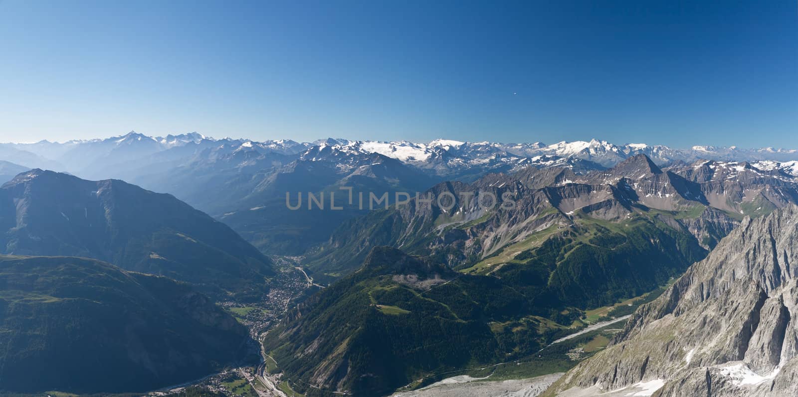 panoramic view of Courmayeur and Aosta Valley from Mont Blanc massif on summer