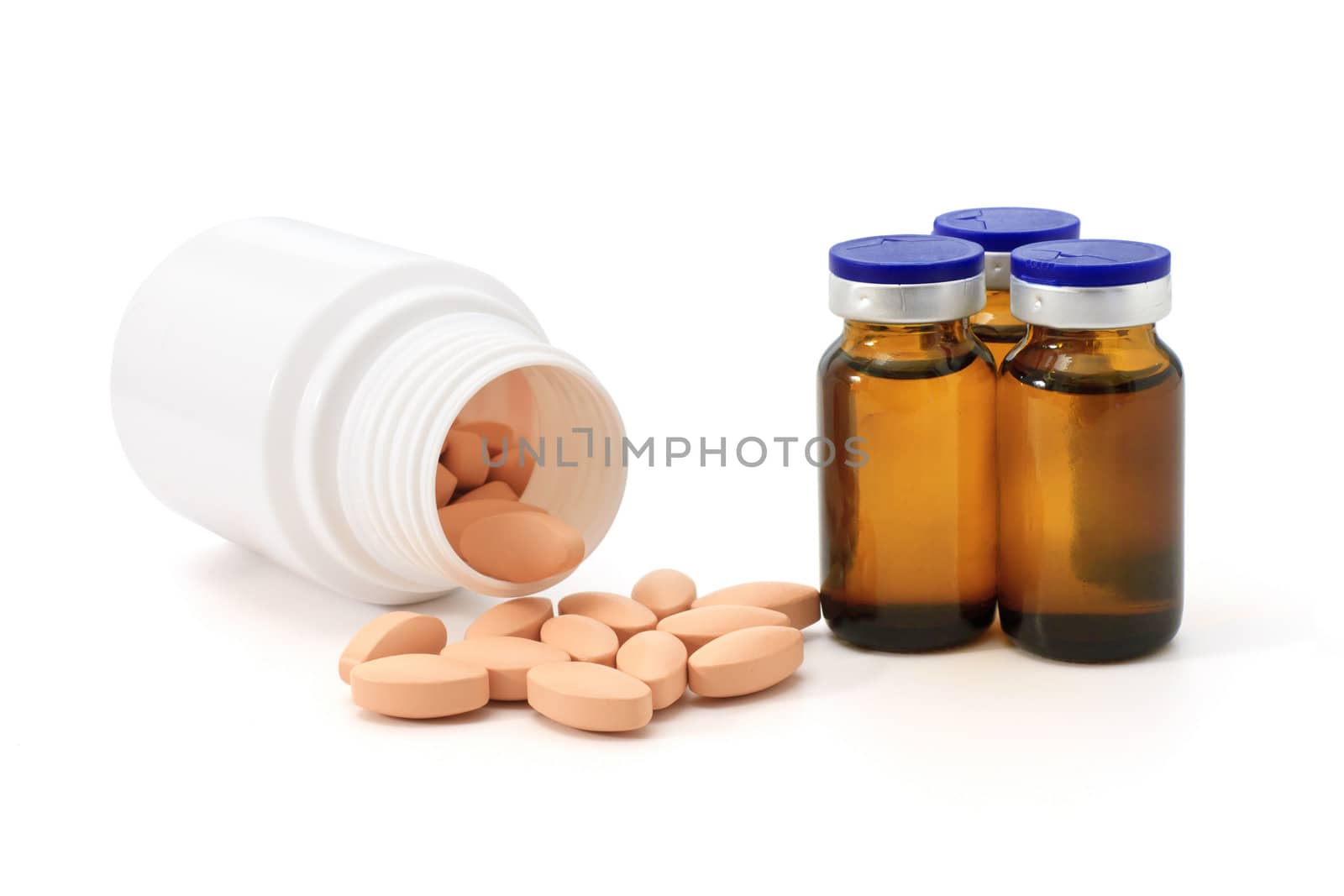 medicine bottles and pills over white background