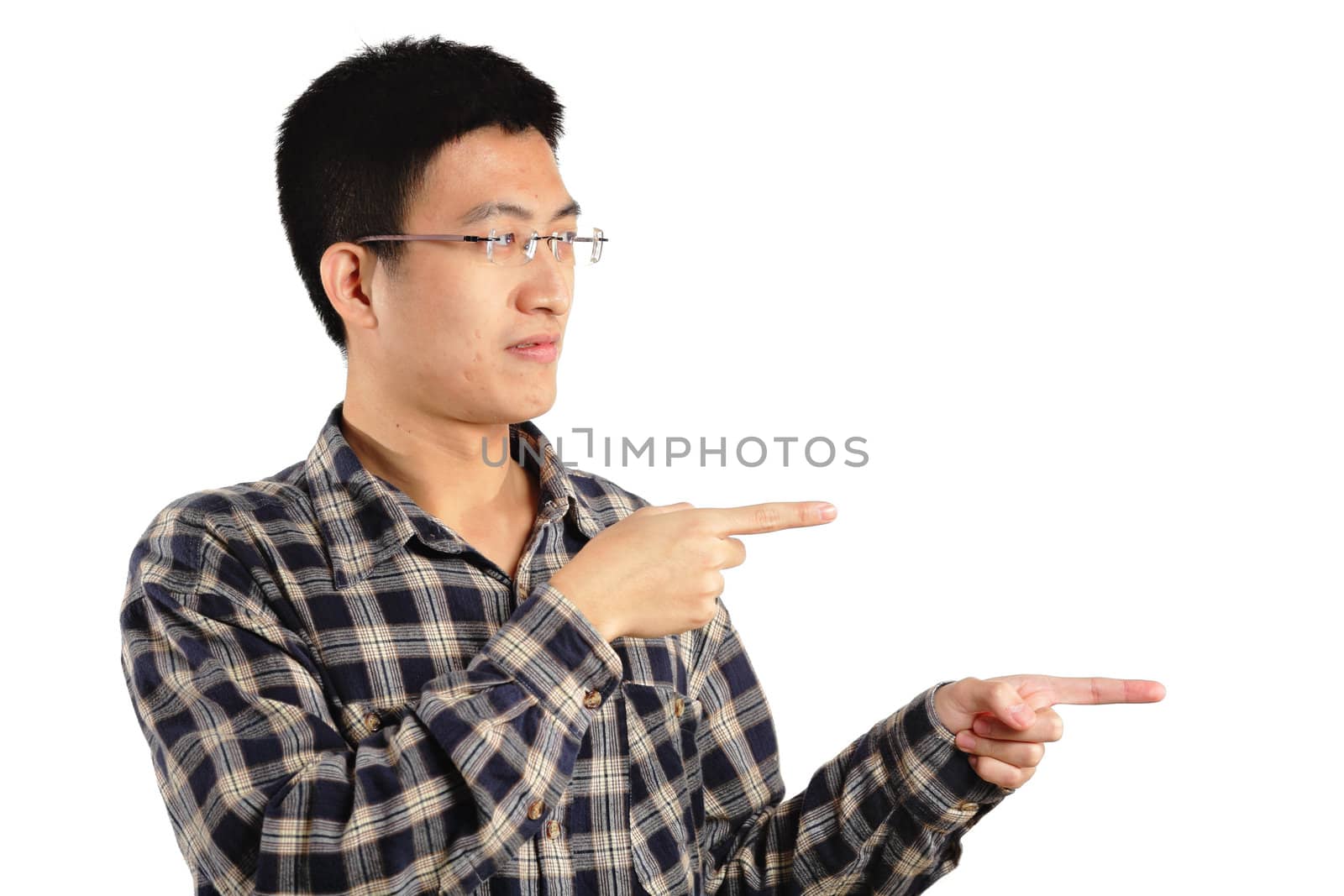 Young asian man pointing