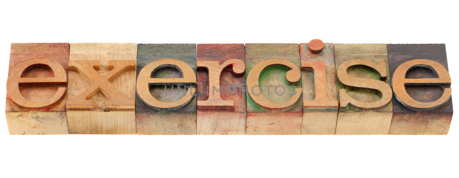 exercise word in vintage wood letterpress printing blocks, isolated on white