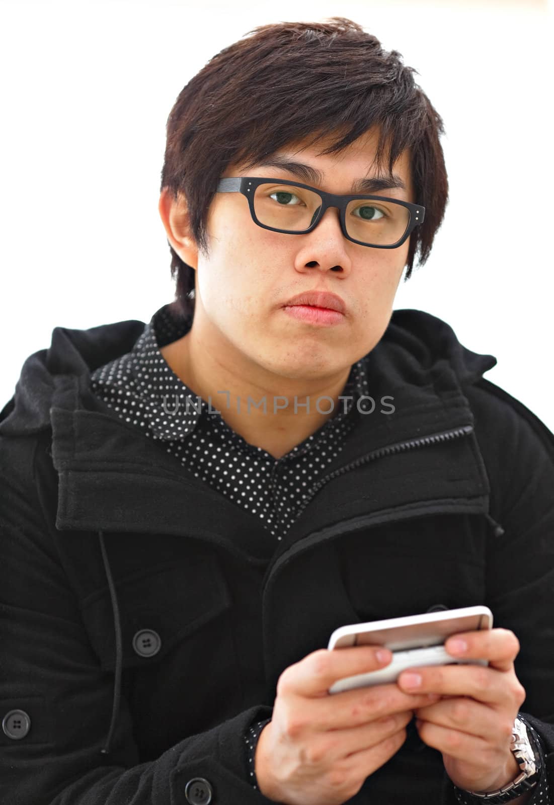 asian man sms on cell phone