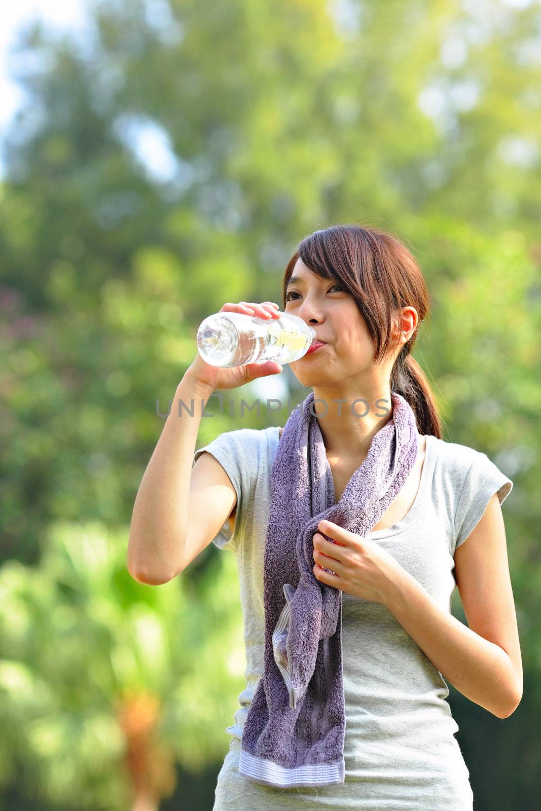 woman drink water after sport