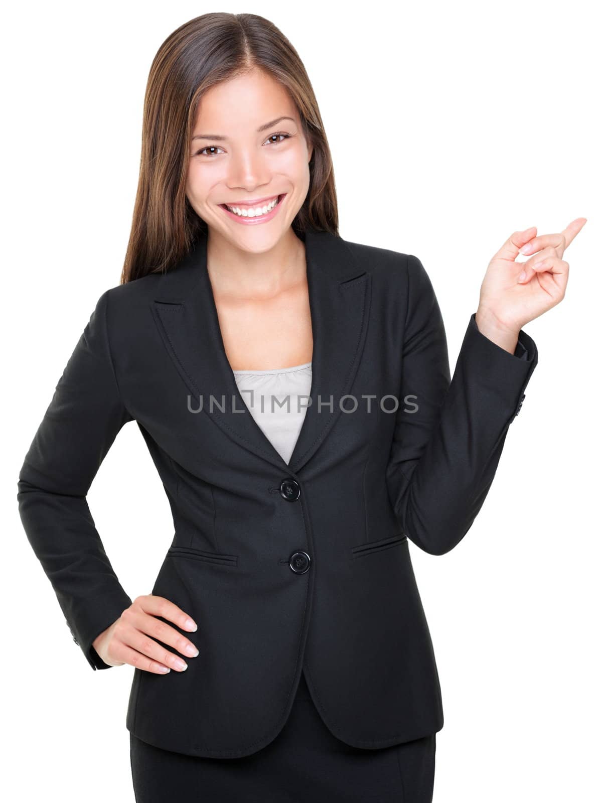 Businesswoman in suit pointing smiling. Isolated on white background. Asian Caucasian female model.