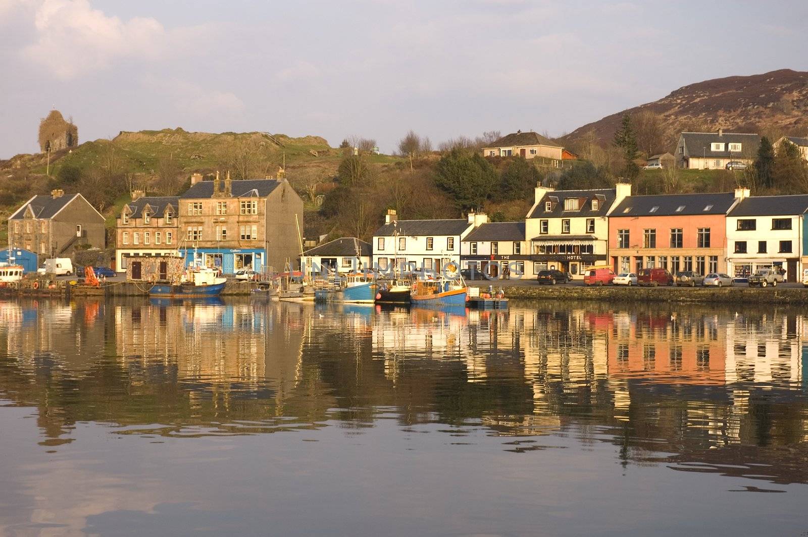 Tarbert Harbor, Tarbert castle  & waterfront reflected in the Loch at sunset