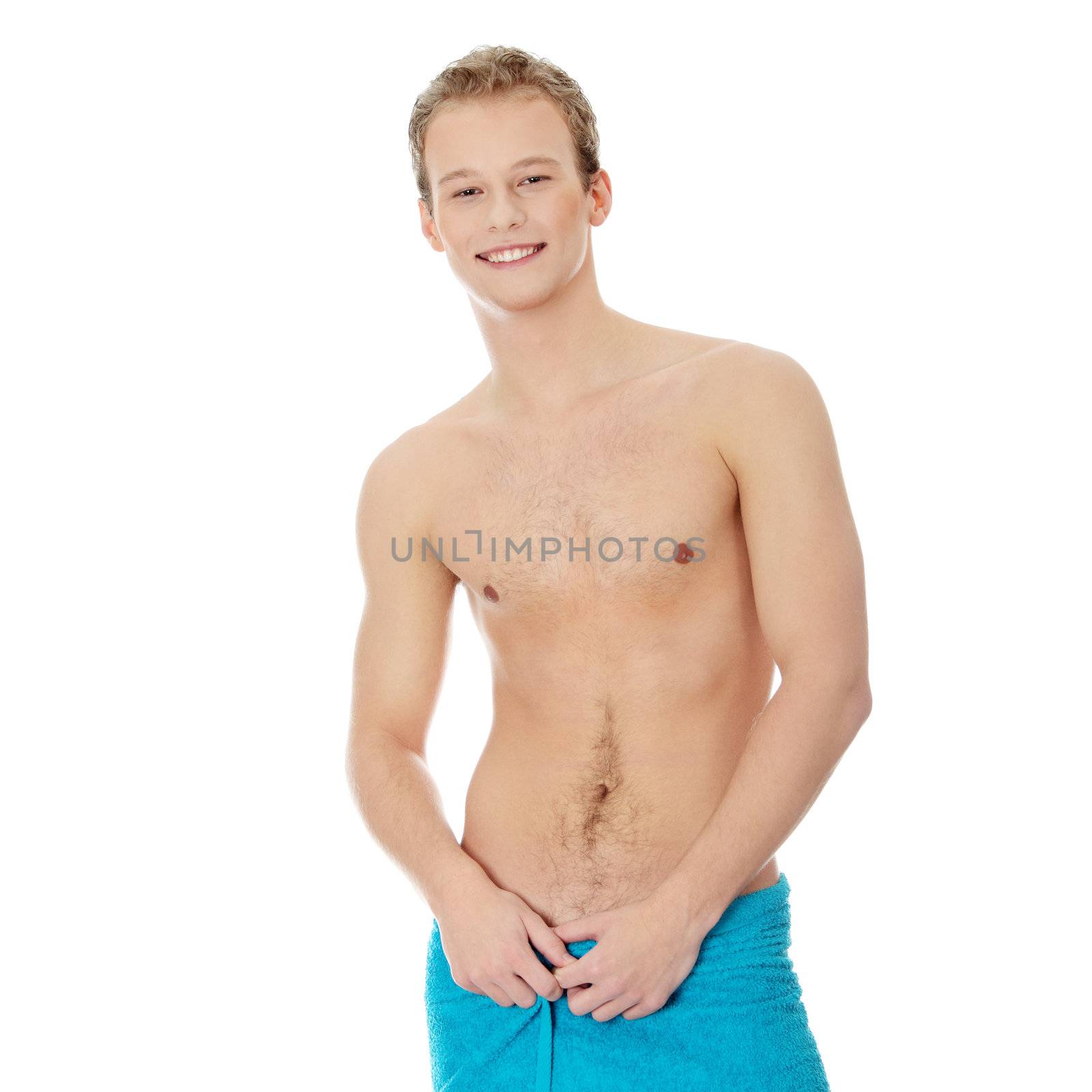 Handsome, young, naked man with the towel around his waist. Isolated on white