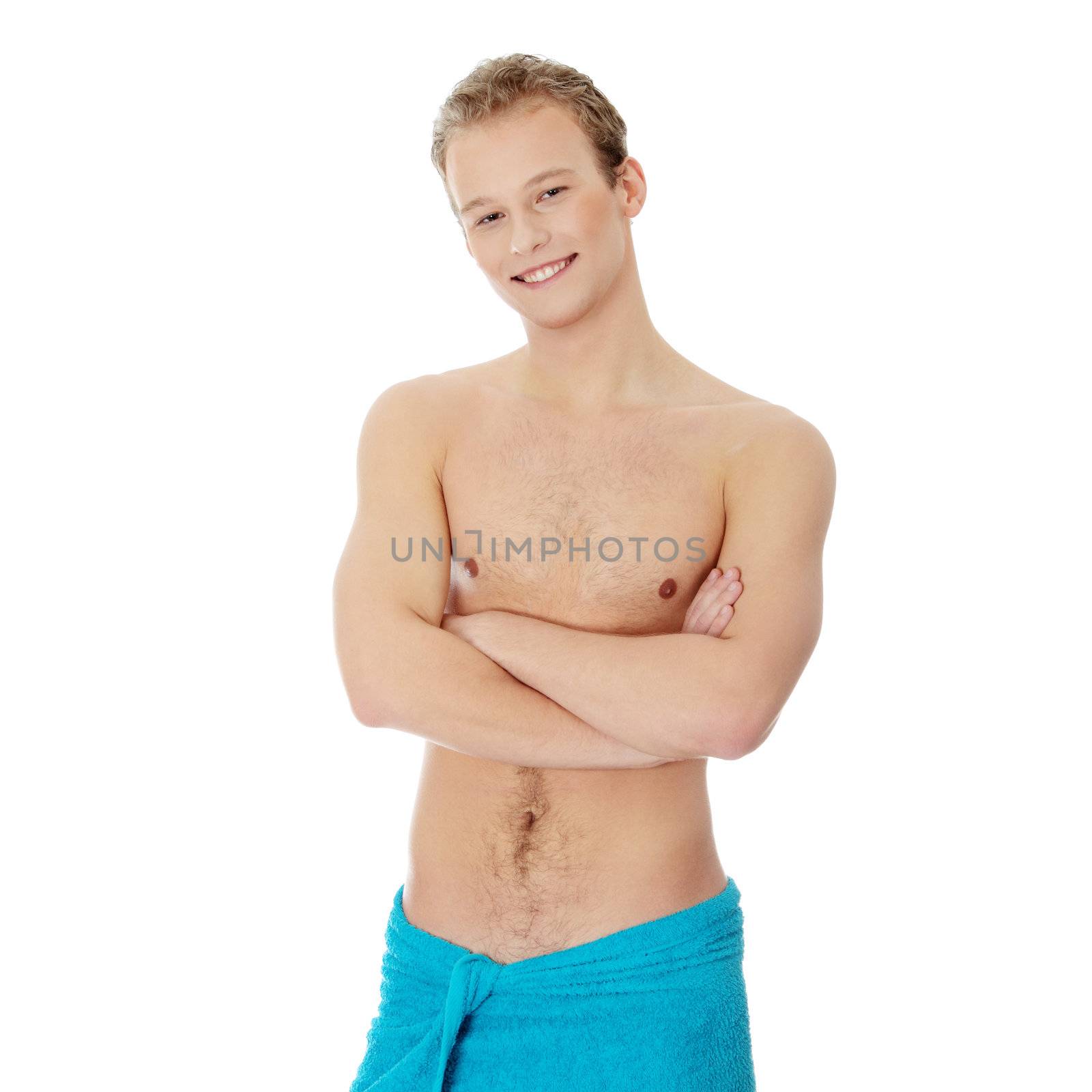 Handsome, young, naked man with the towel around his waist. Isolated on white