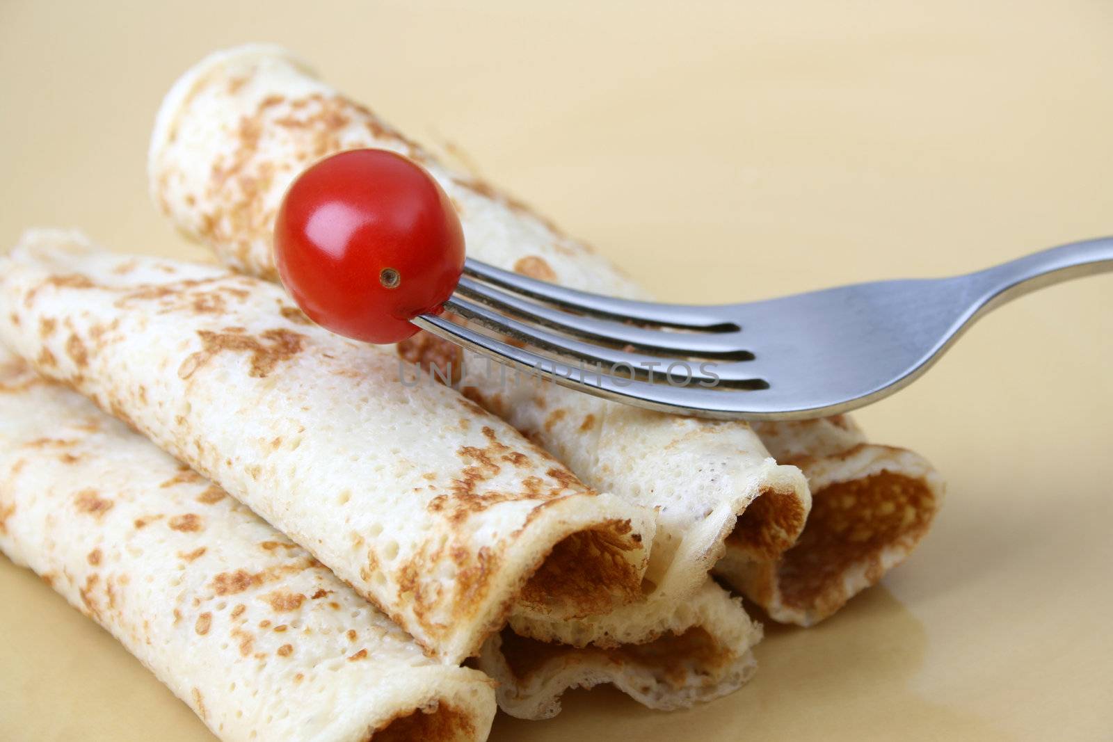 Close up of pancakes on a yellow plate