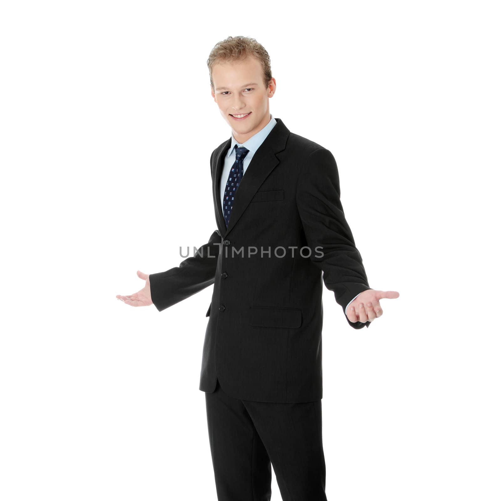 Happy young businessman standing, isoalted on white background