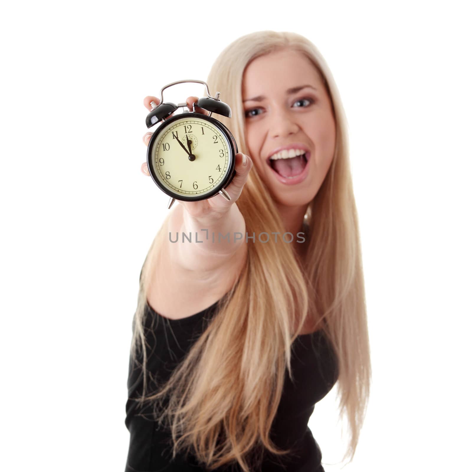 Young blond woman showing alarm clock, isolated on white