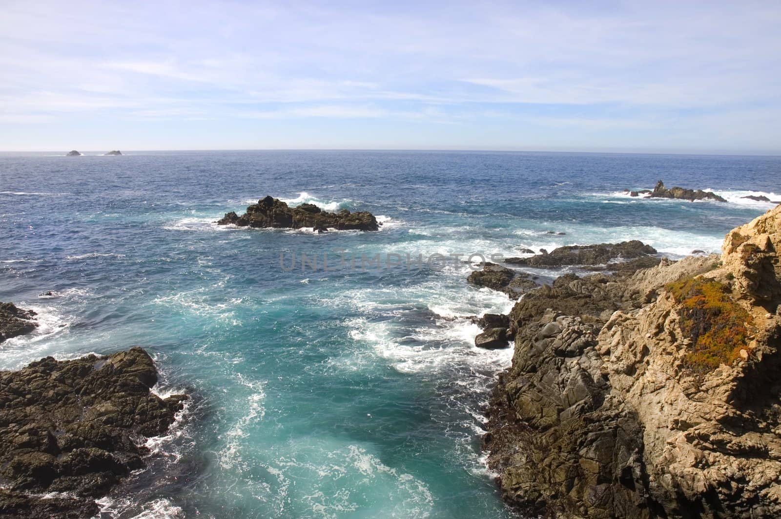 View of the cliffs and the Pacific Ocean from the the headlands south of Monterey in California
