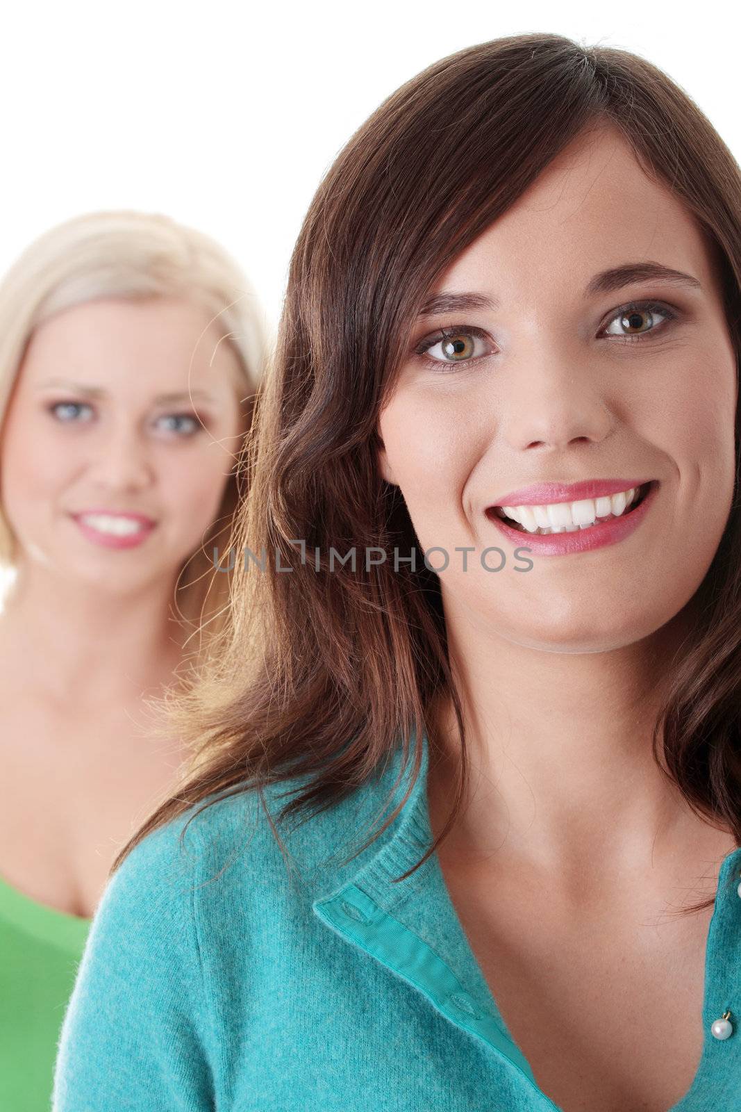 Two happy girls isolated on white