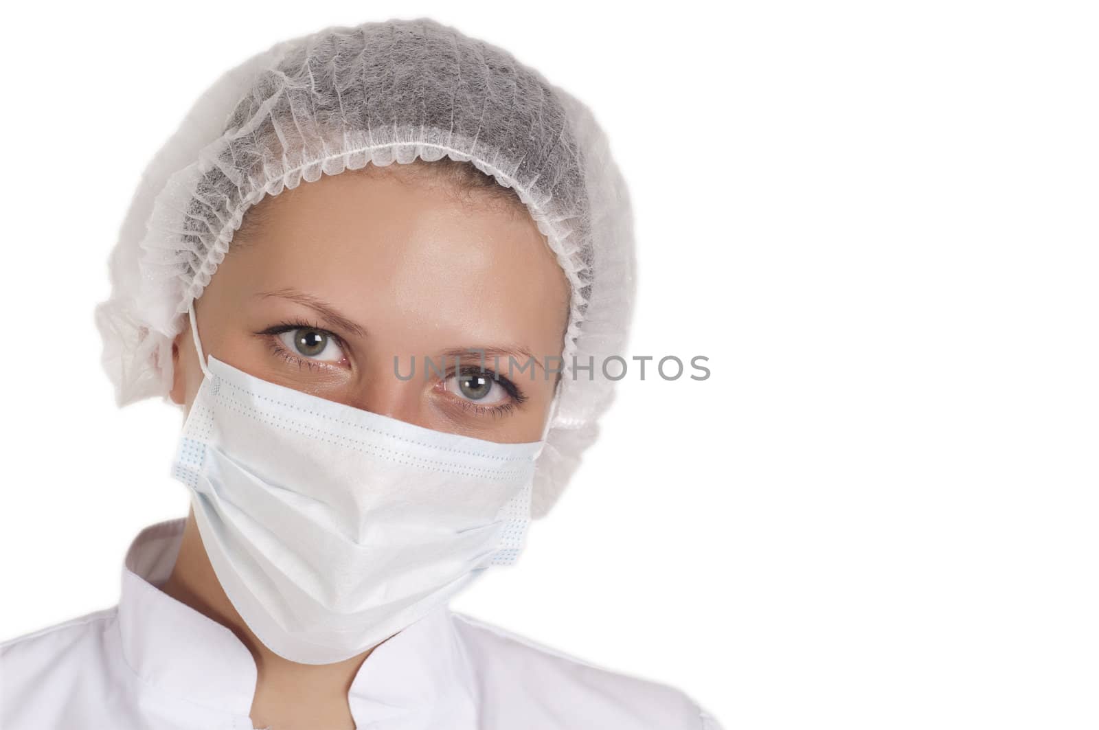 portrait of a young doctor in a medical cap and mask