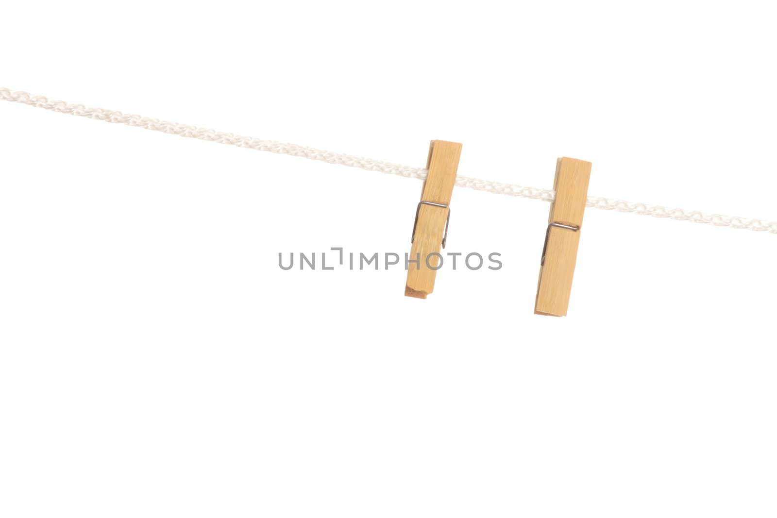 Clothespin on line isolated on white background