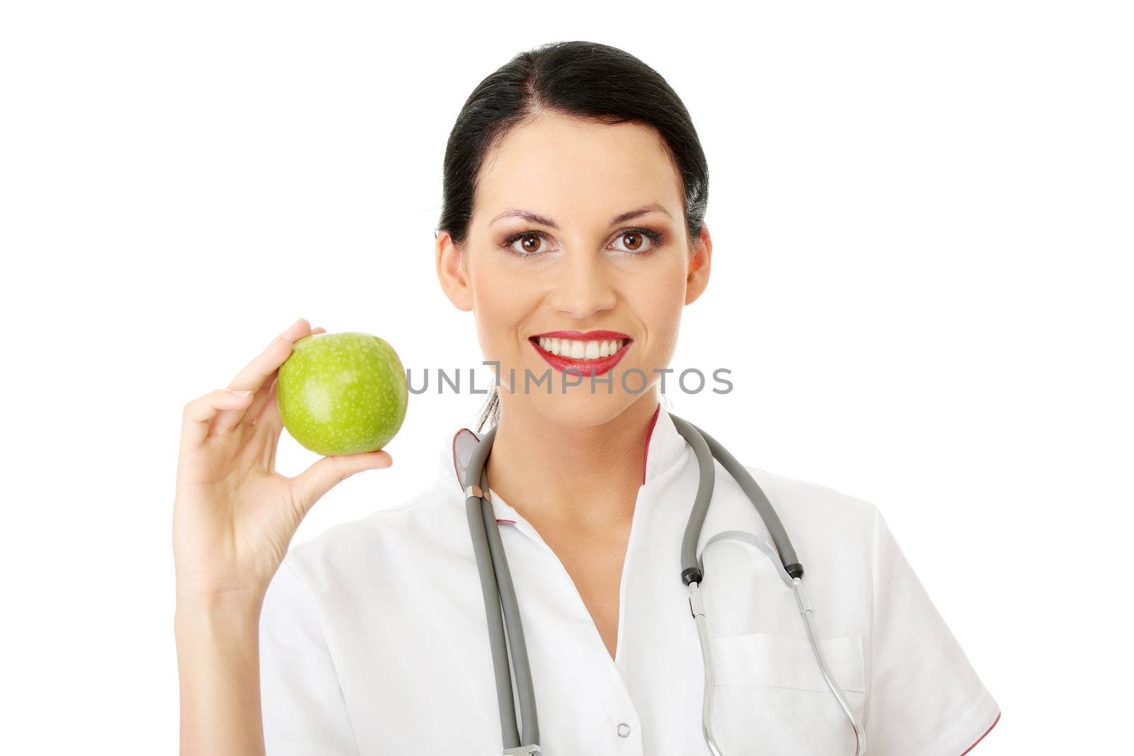 Healthy eating or lifestyle concept. Smiling woman doctor with a green apple.