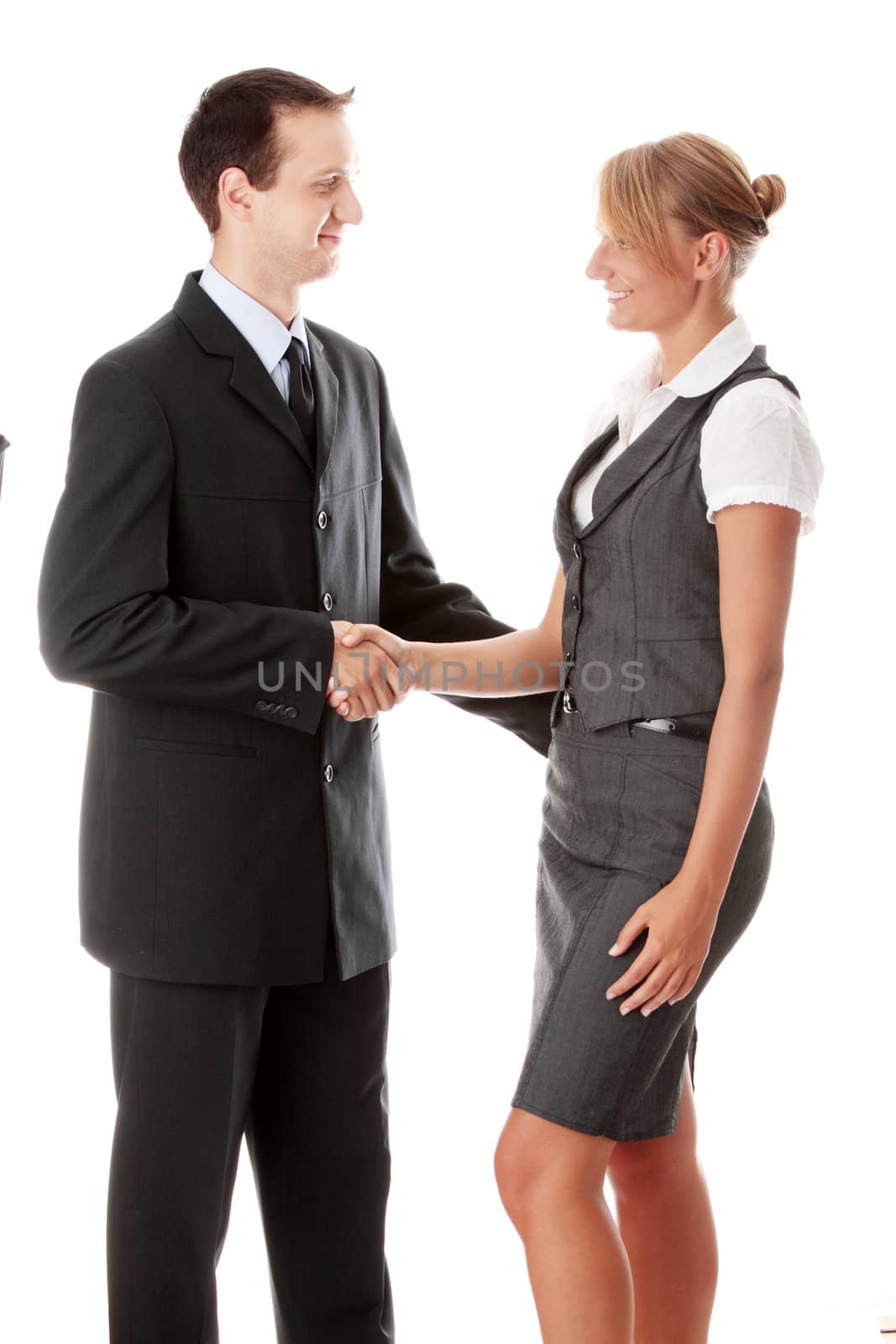 Young business couple handshaking isolated on white