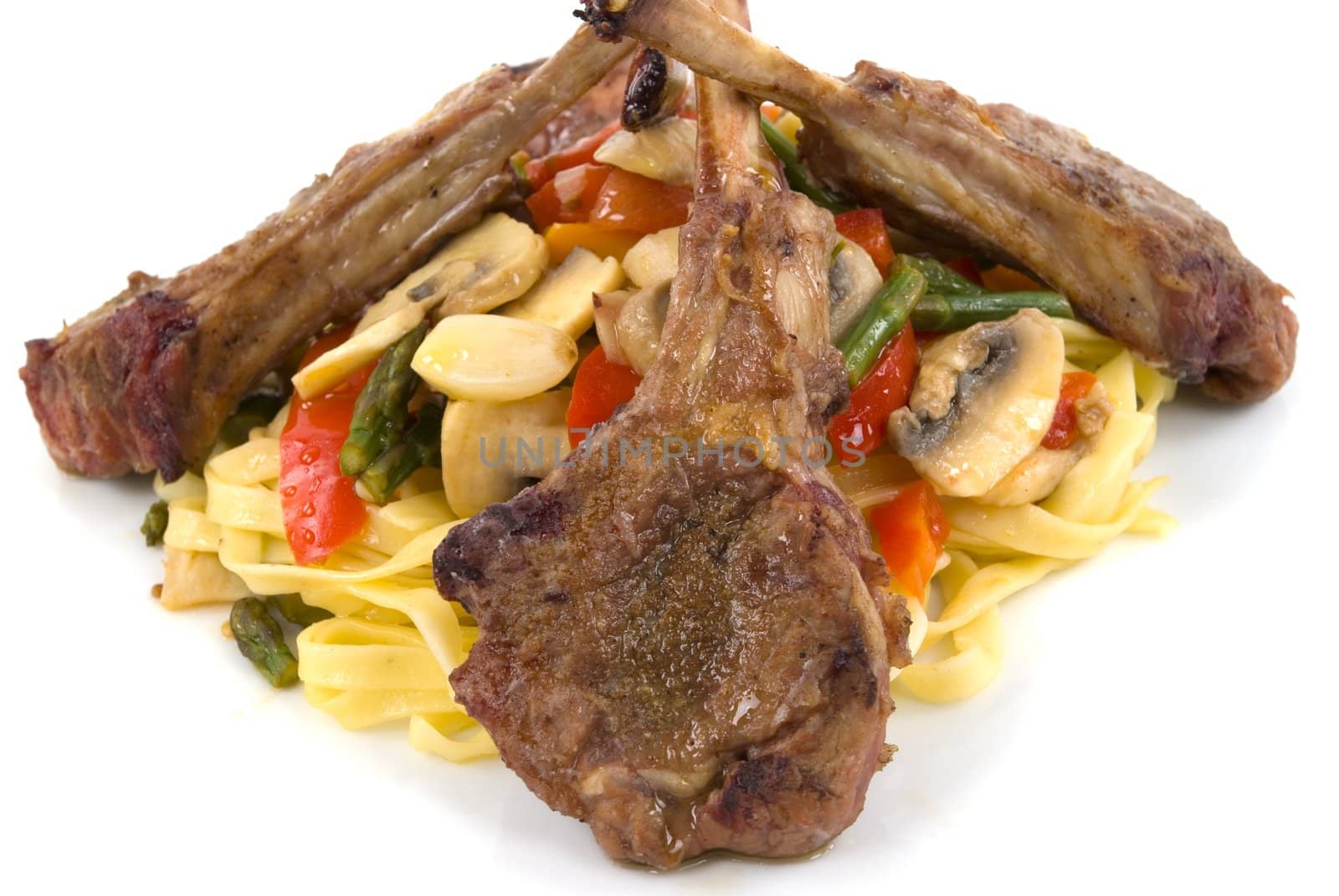 Lamb chops, homemade pasta with tomatoes, asparagus, red and orange bell peppers, mushroom, shallots, and garlic