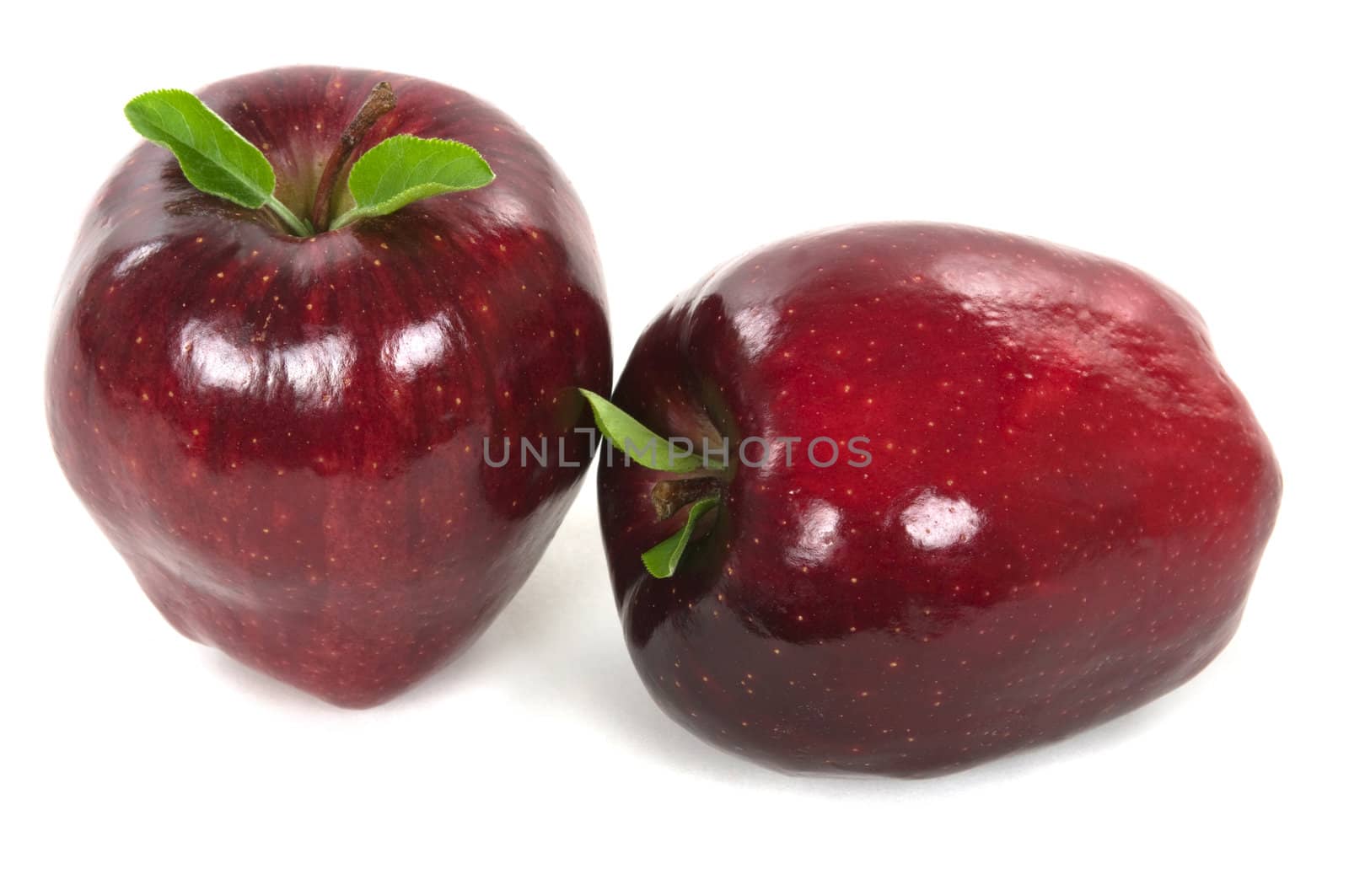 Organic red apples with leaves