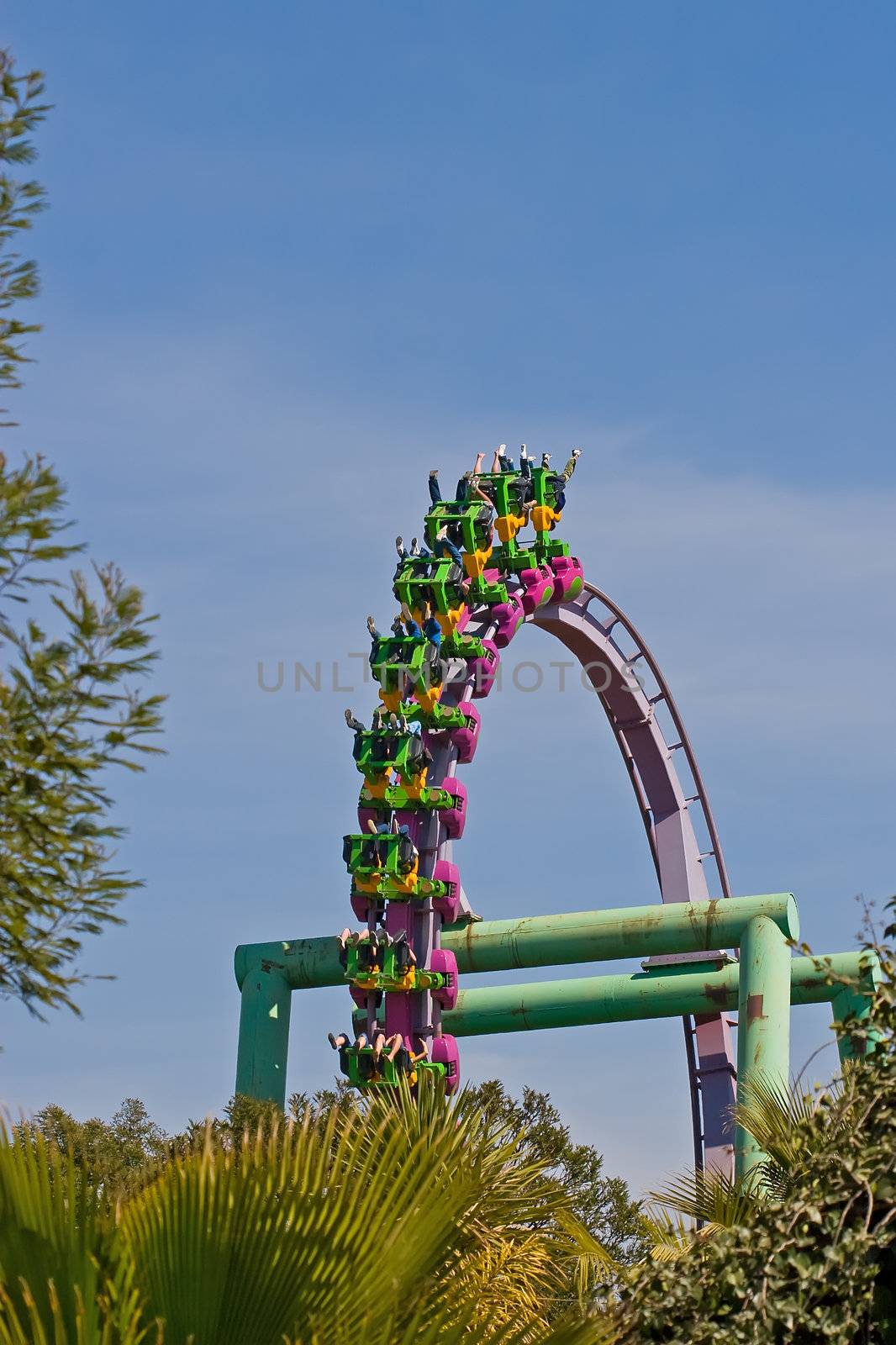 Rollercoaster loop against a brilliant blue sky