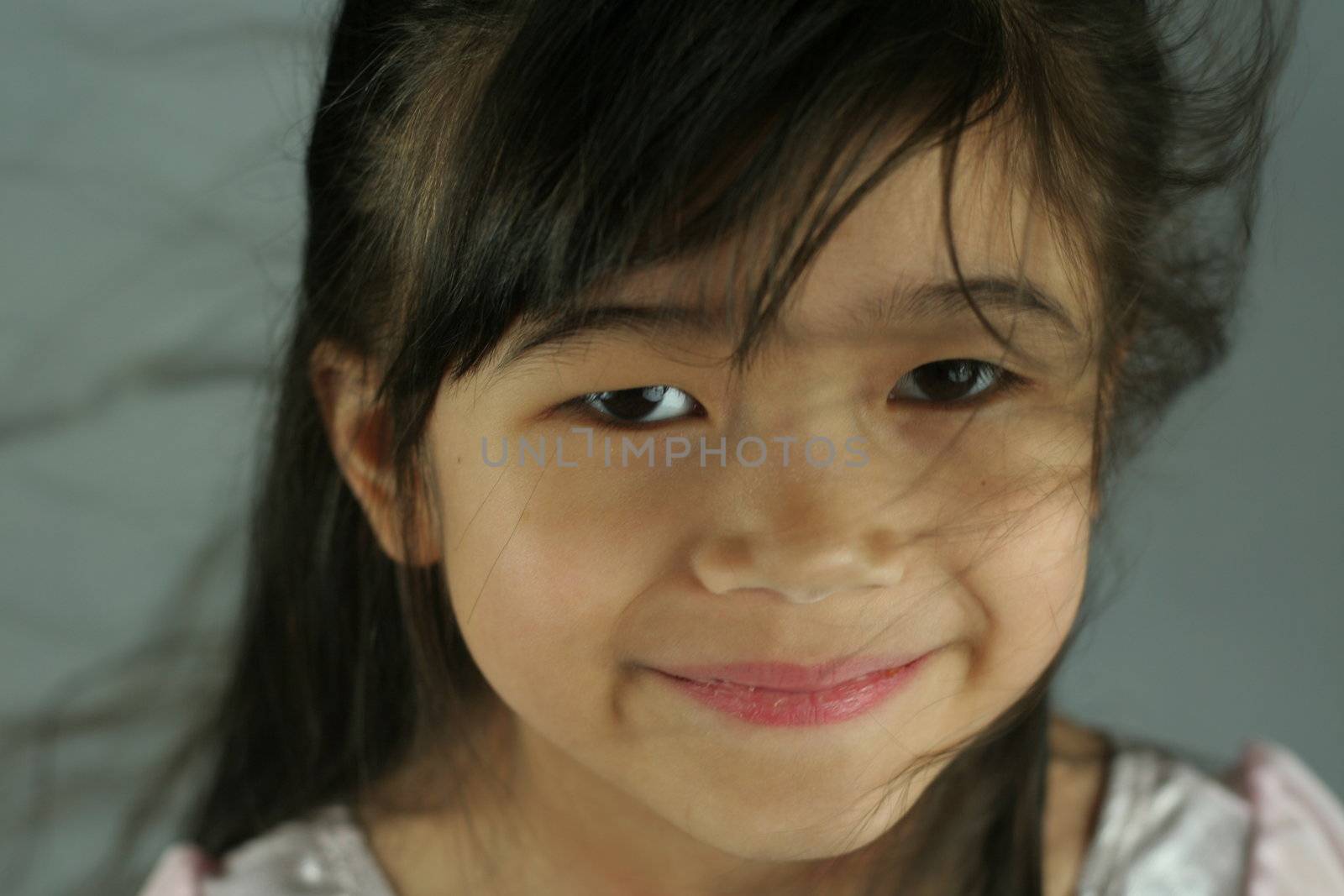 Beautiful child smiling into camera by jarenwicklund