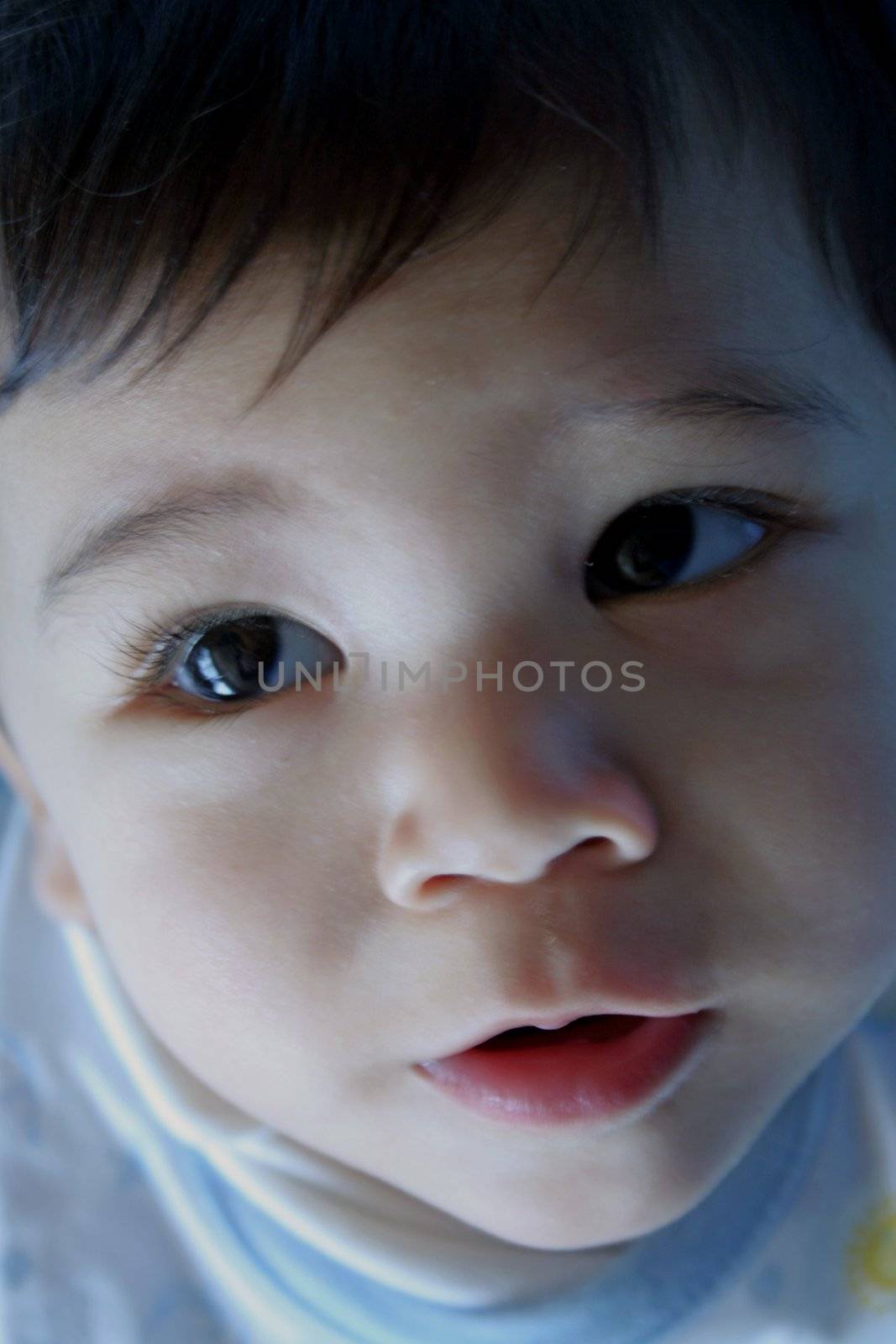 Baby looking up with lovely expression by jarenwicklund