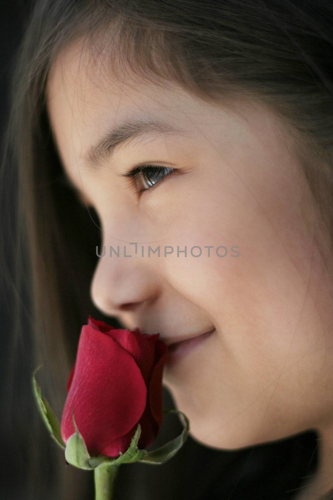 Child with red rose by jarenwicklund