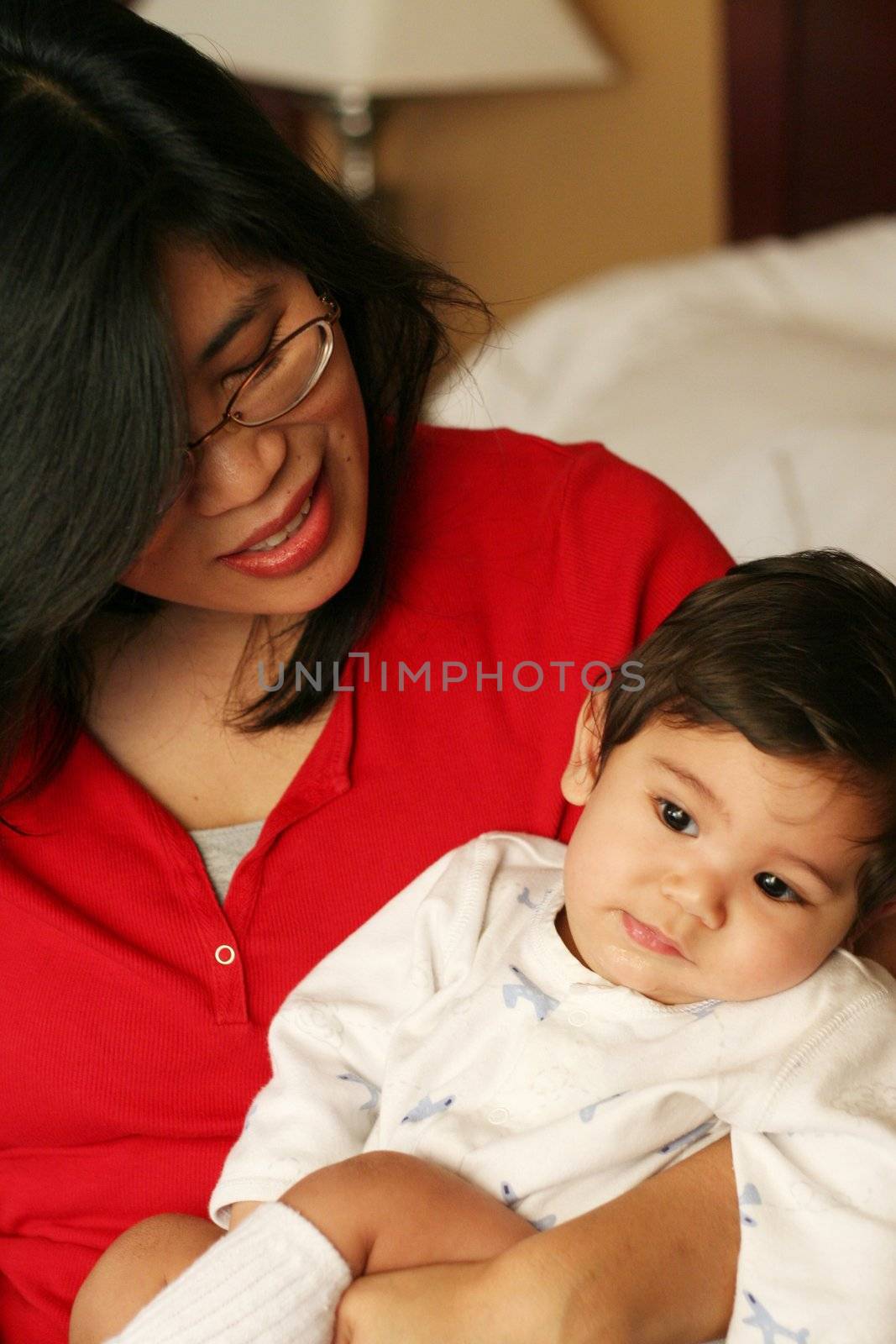 Asian mother and baby enjoying a quiet time in the morning