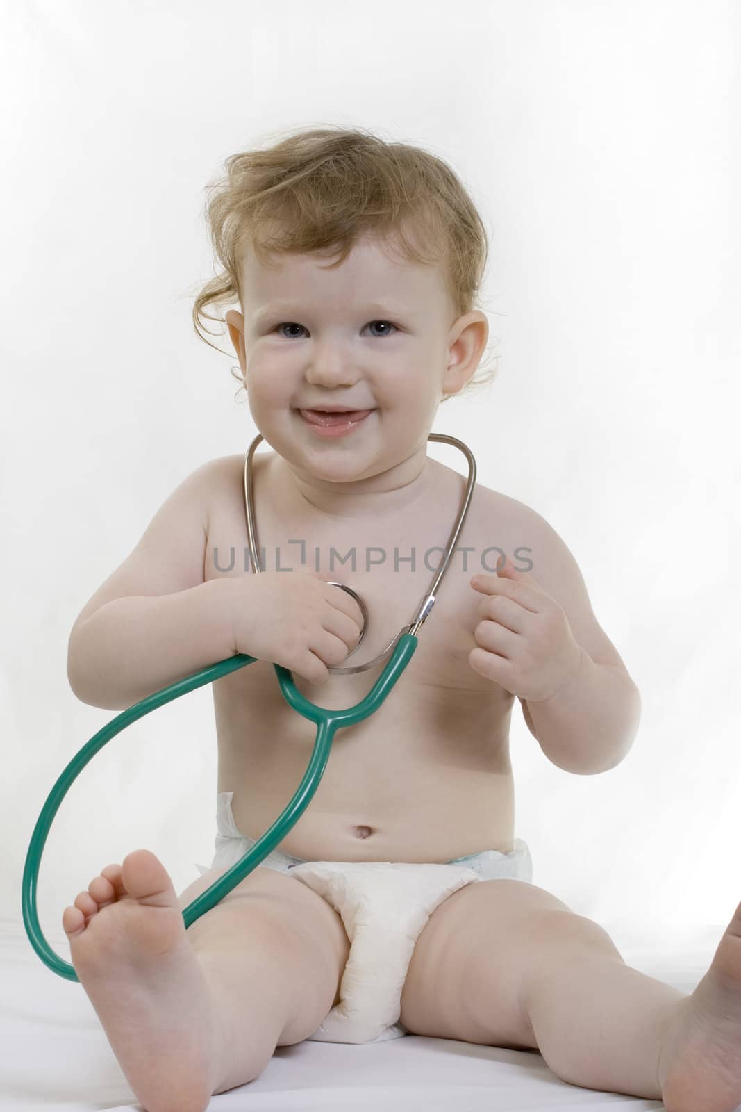 Child with a green stethoscope