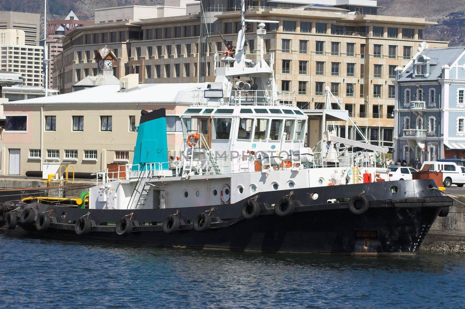 Tugboat moored in the harbour, waiting for the next ship