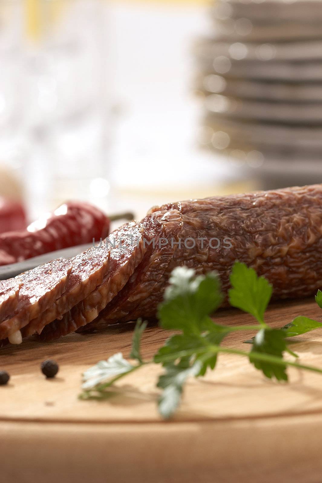 still life with summer sausage and parsley