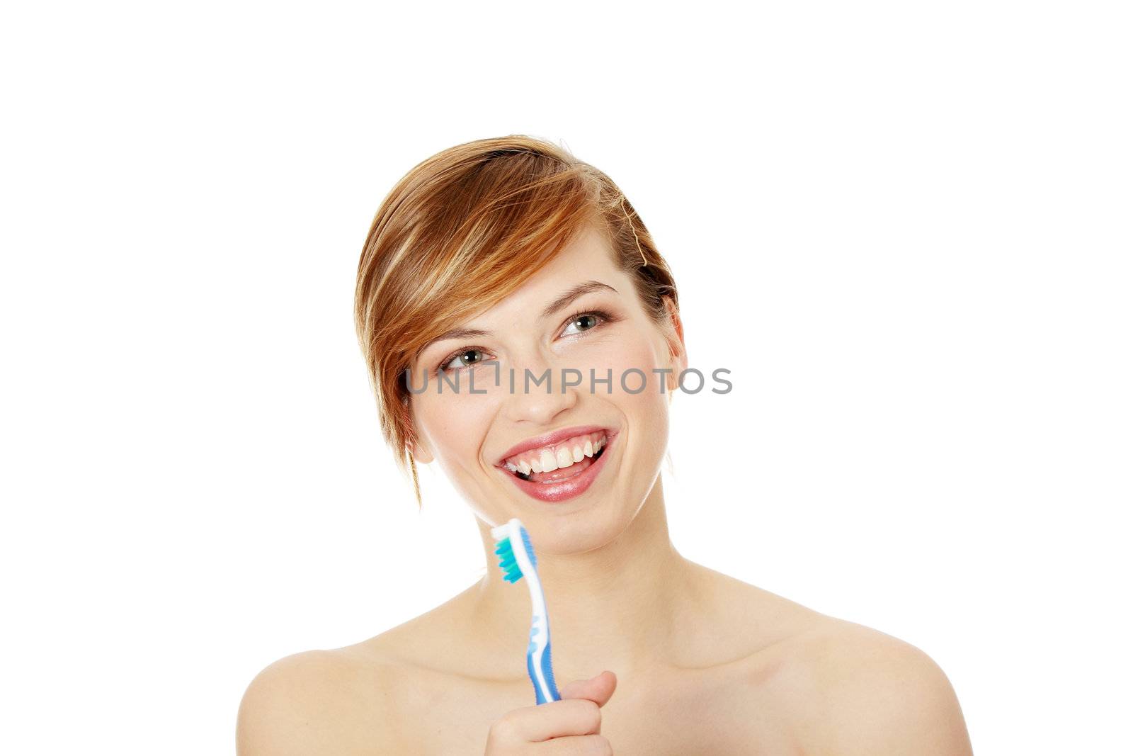 Happy teen girl singing to tooth brush, isolated on white
