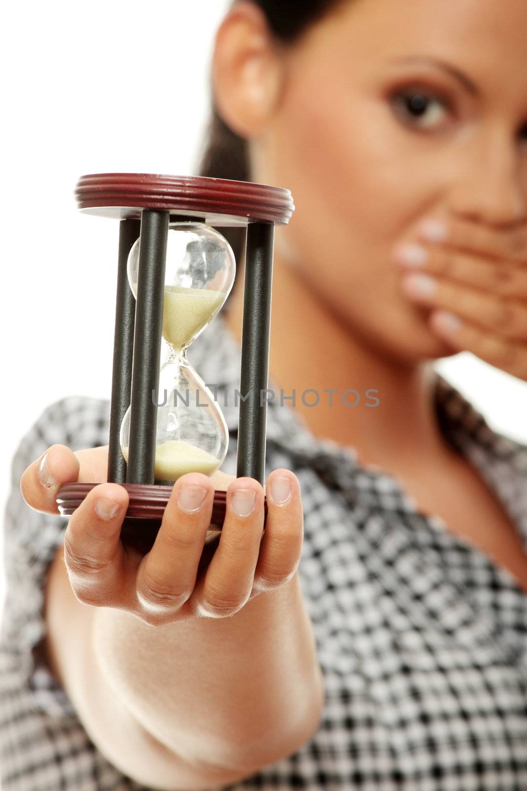 Young business woman with hourglass - time concept 