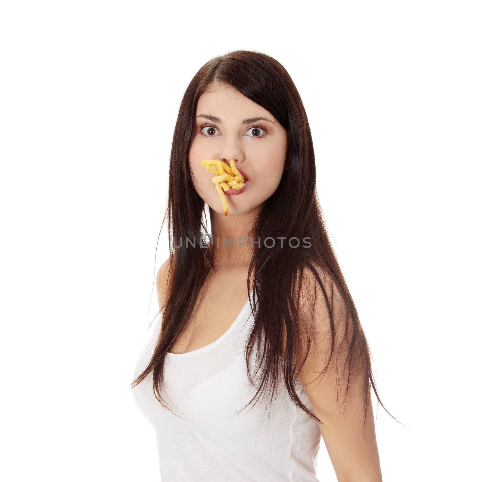 Young woman eating french fries by BDS