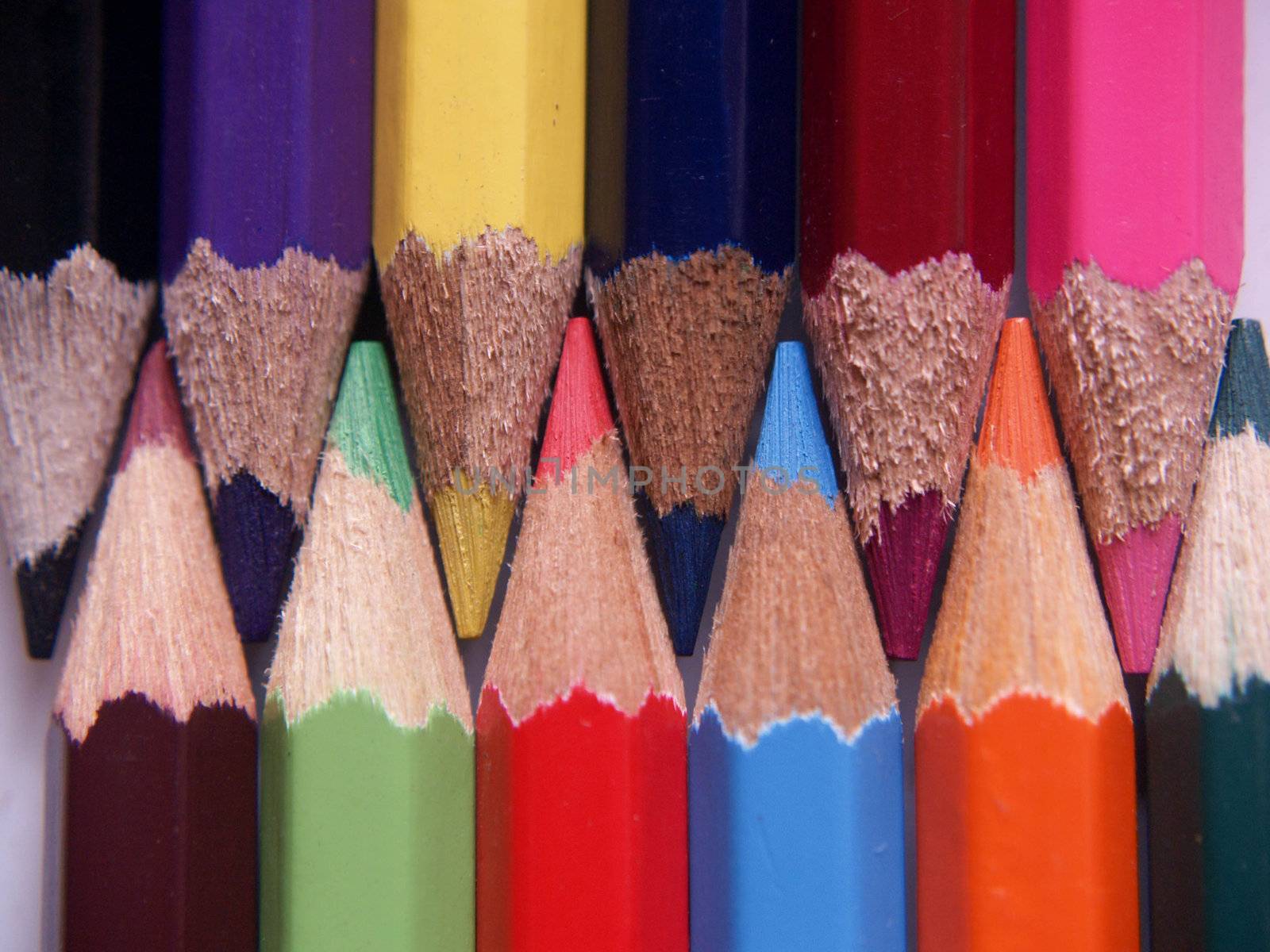 A colorful collage of colored pencil points.
