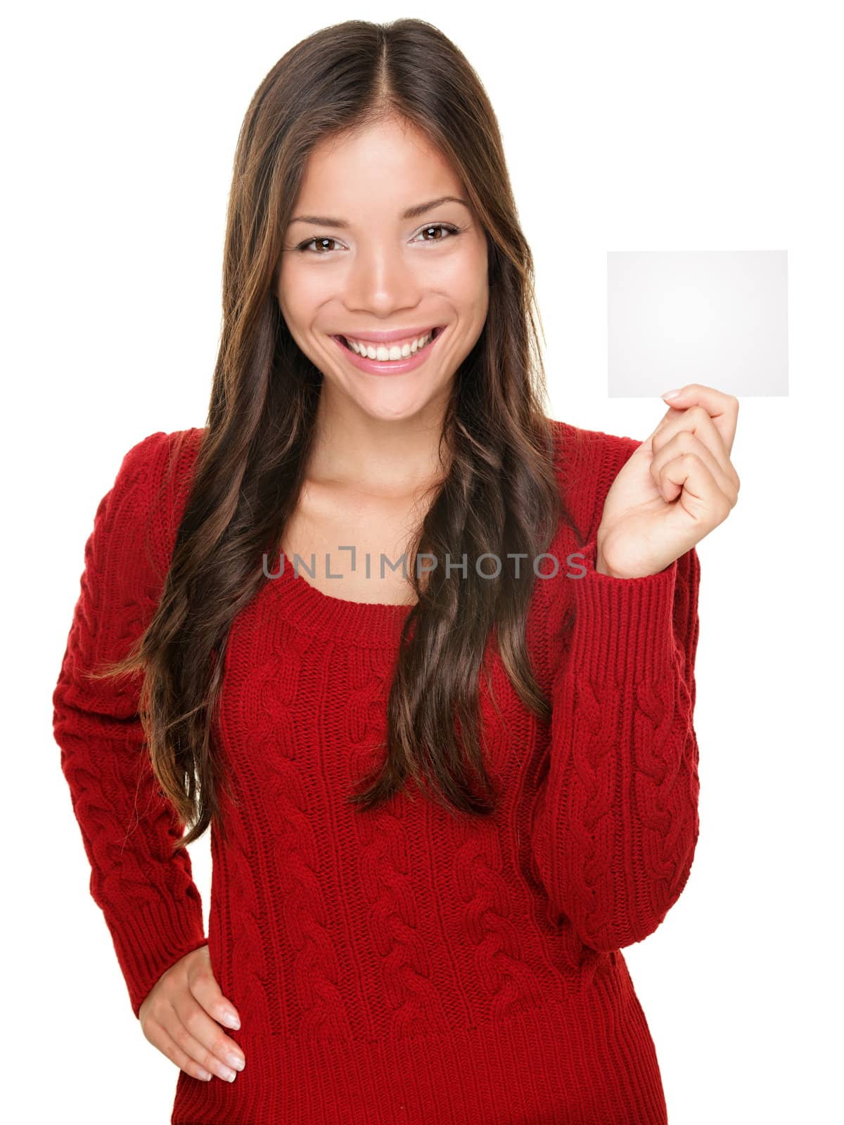 showing woman presenting blank gift card sign. Happy smiling Asian woman in red winter sweater isolated on white background.