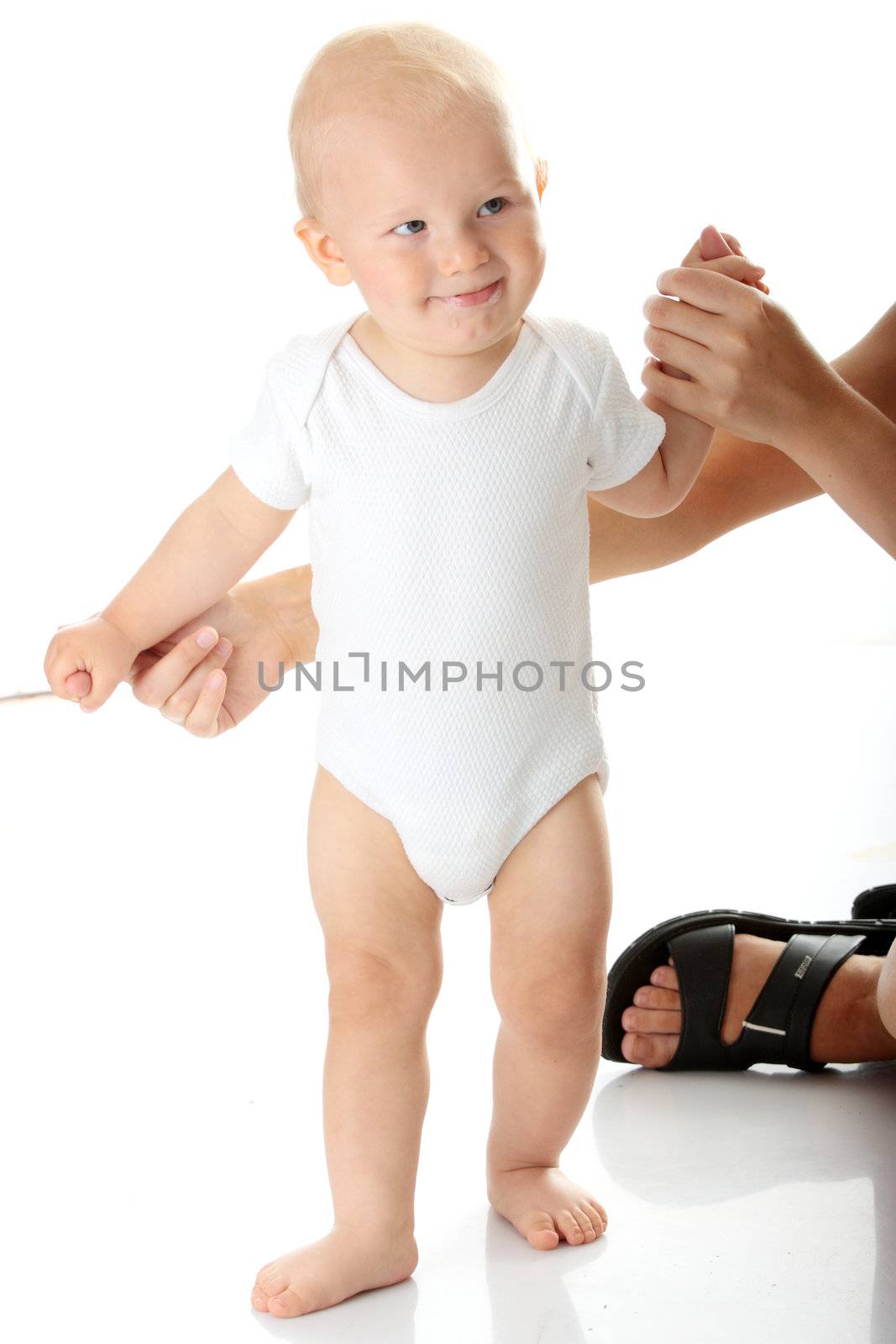 First steps of small baby isolated on white