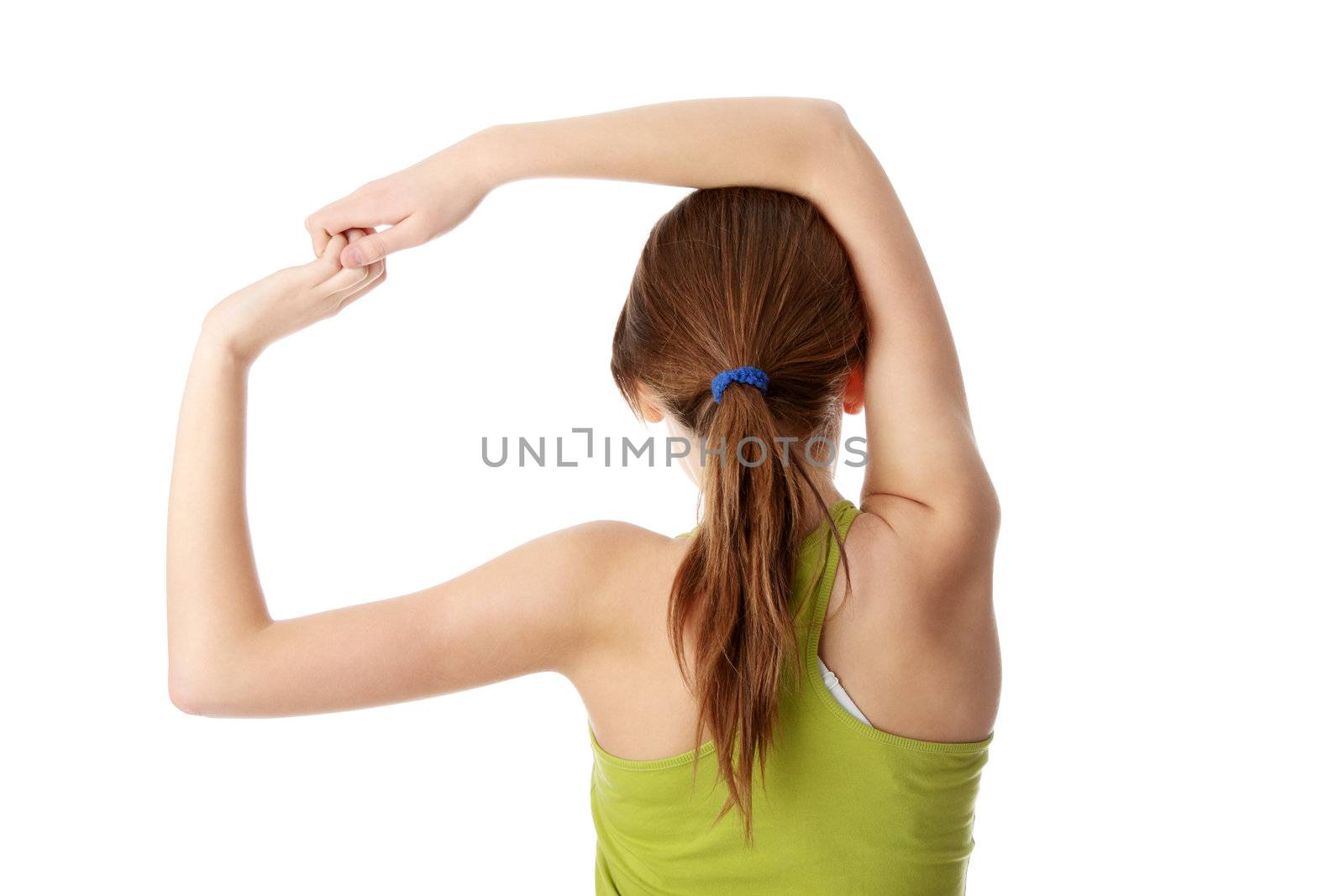 Teen girl exercising isolated on white background