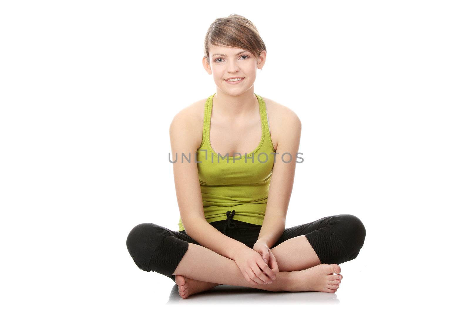 Teen girl exercising isolated on white background