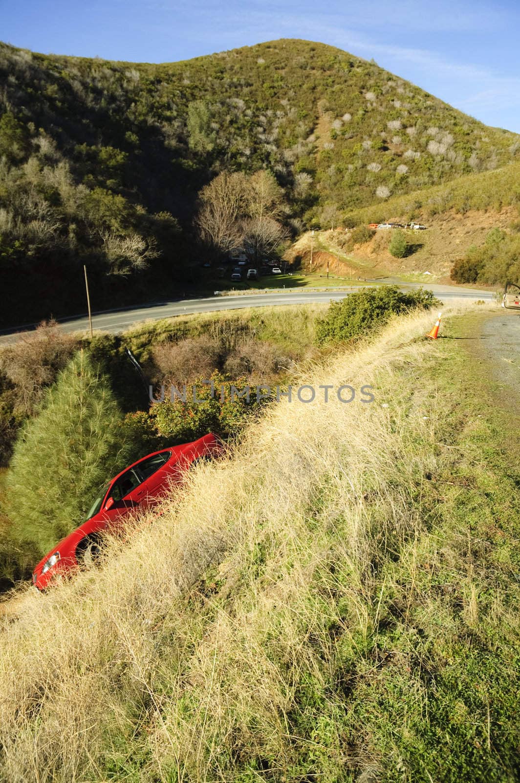 Car slid off the road and down a slope in Northern california