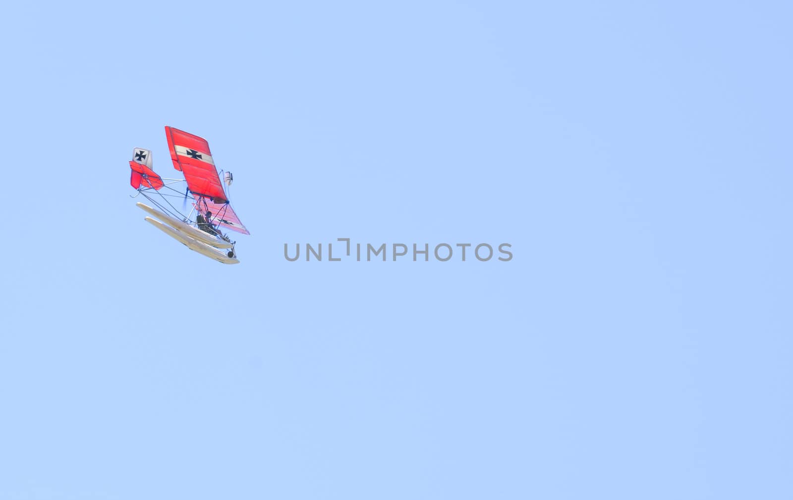 Ultralight aricraft with pontoons and displaying the Insignia of the Red Baron