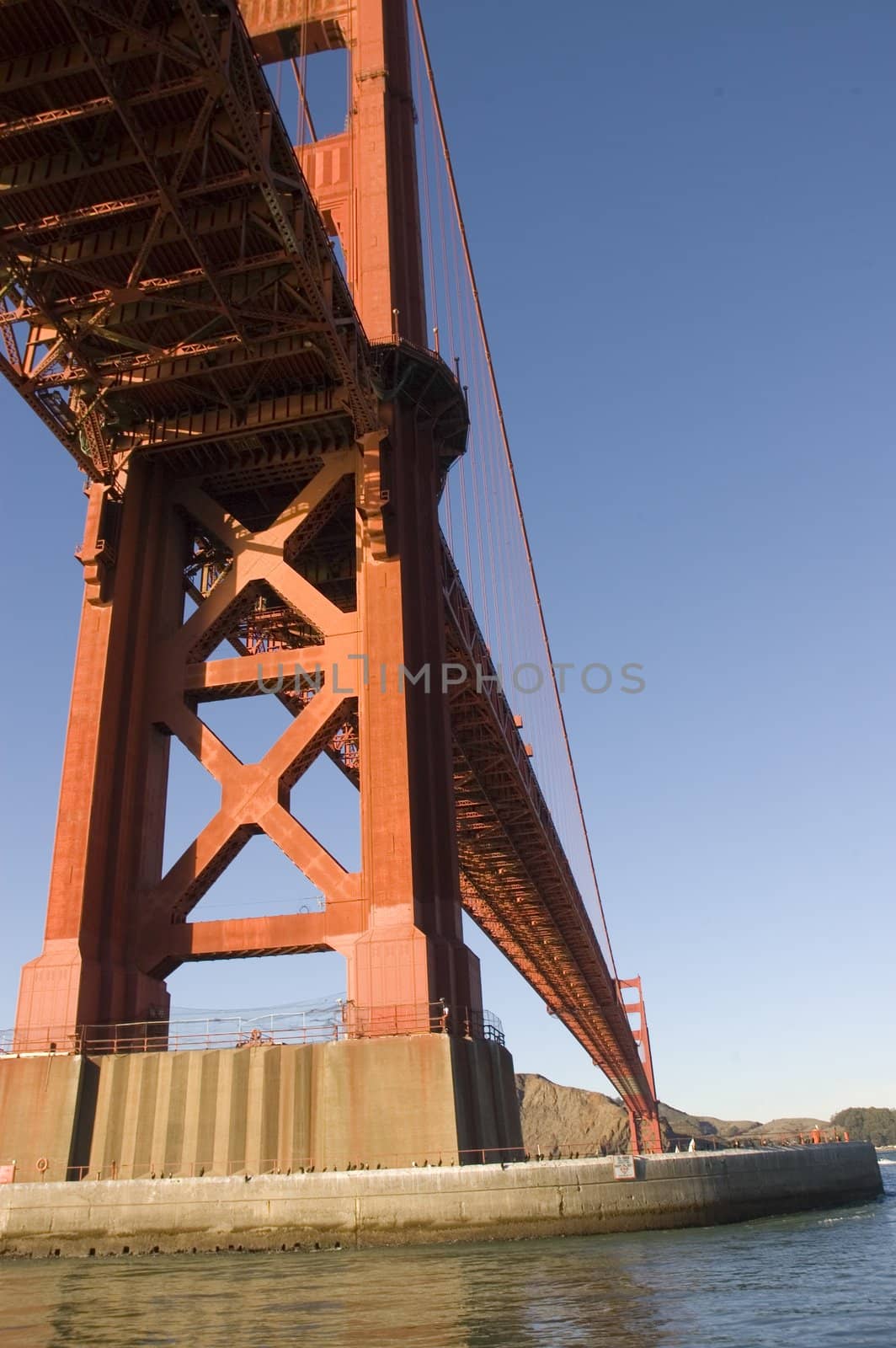 Golden gate bridge from a boat under the bridge by jeffbanke