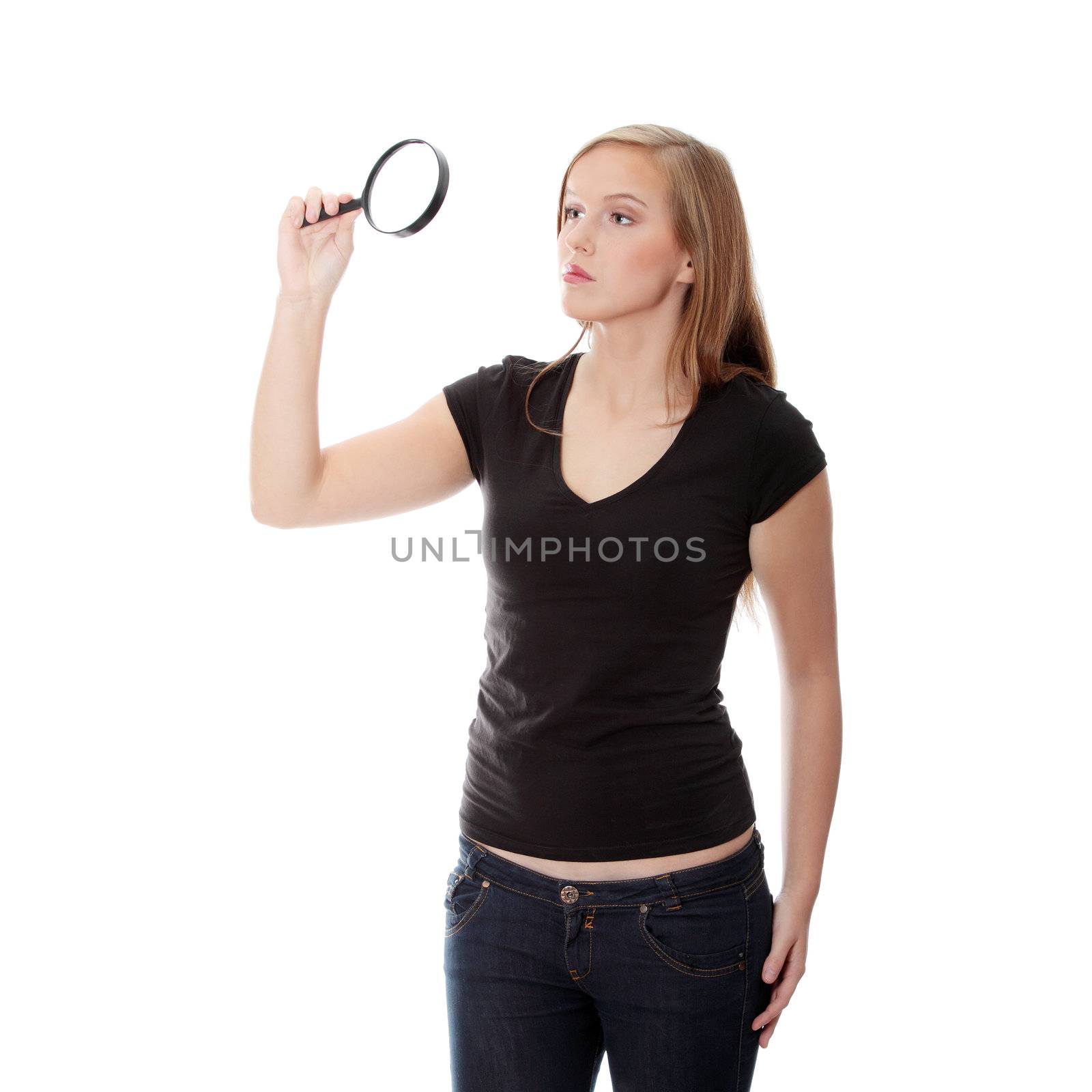 Teen girl with magnifier, isolated on white